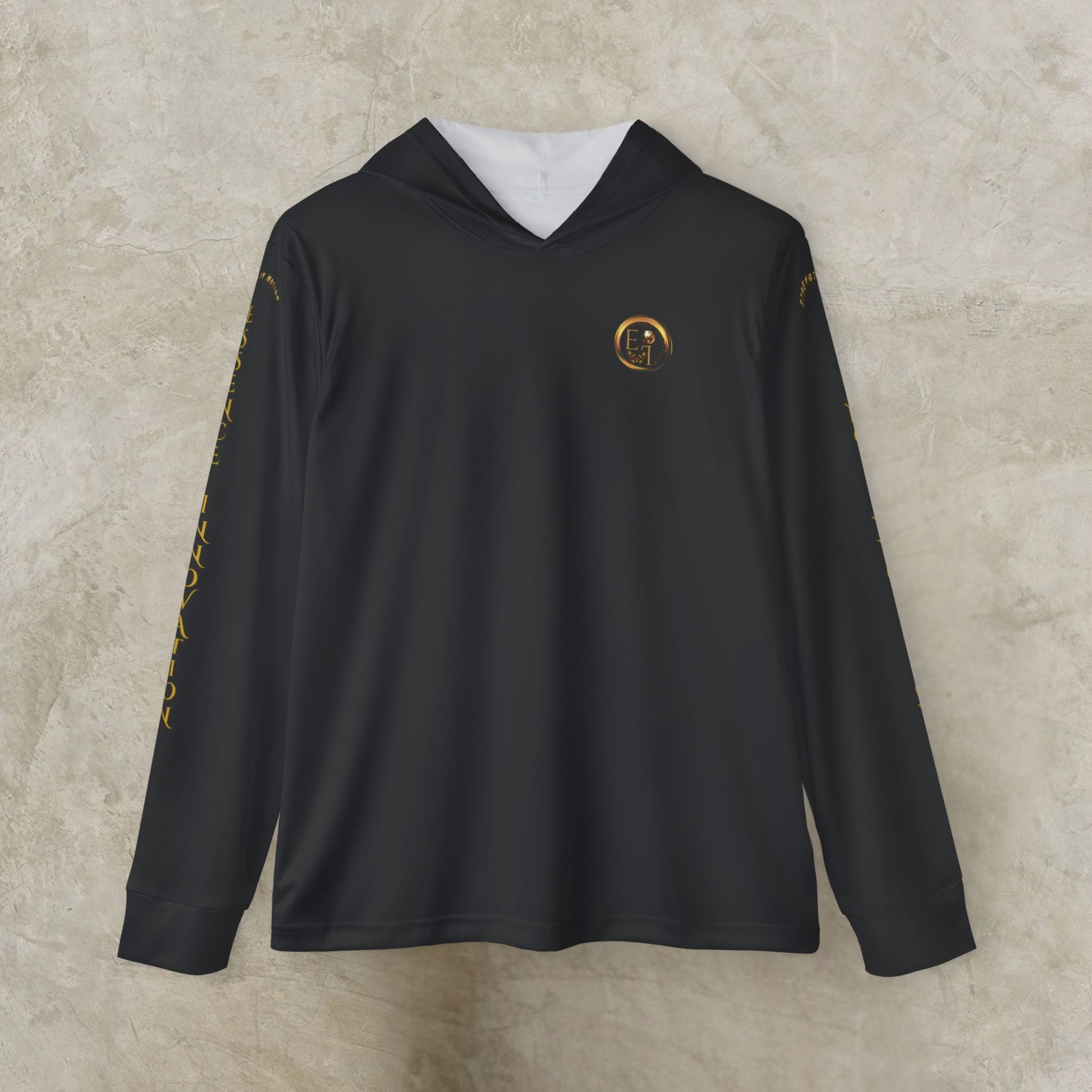 Black Essence Innovation Seek More hoodie with gold accents on a beige background