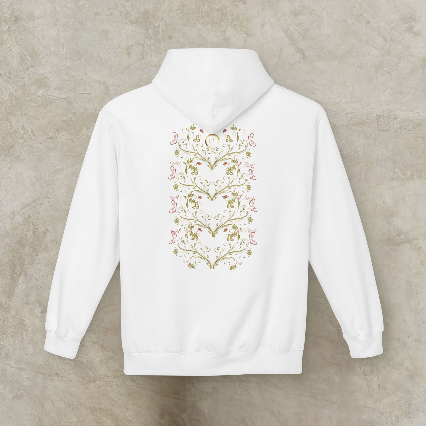 White hoodie with floral Essence Innovation Bohemian Butterfly heart design on the back against a beige background