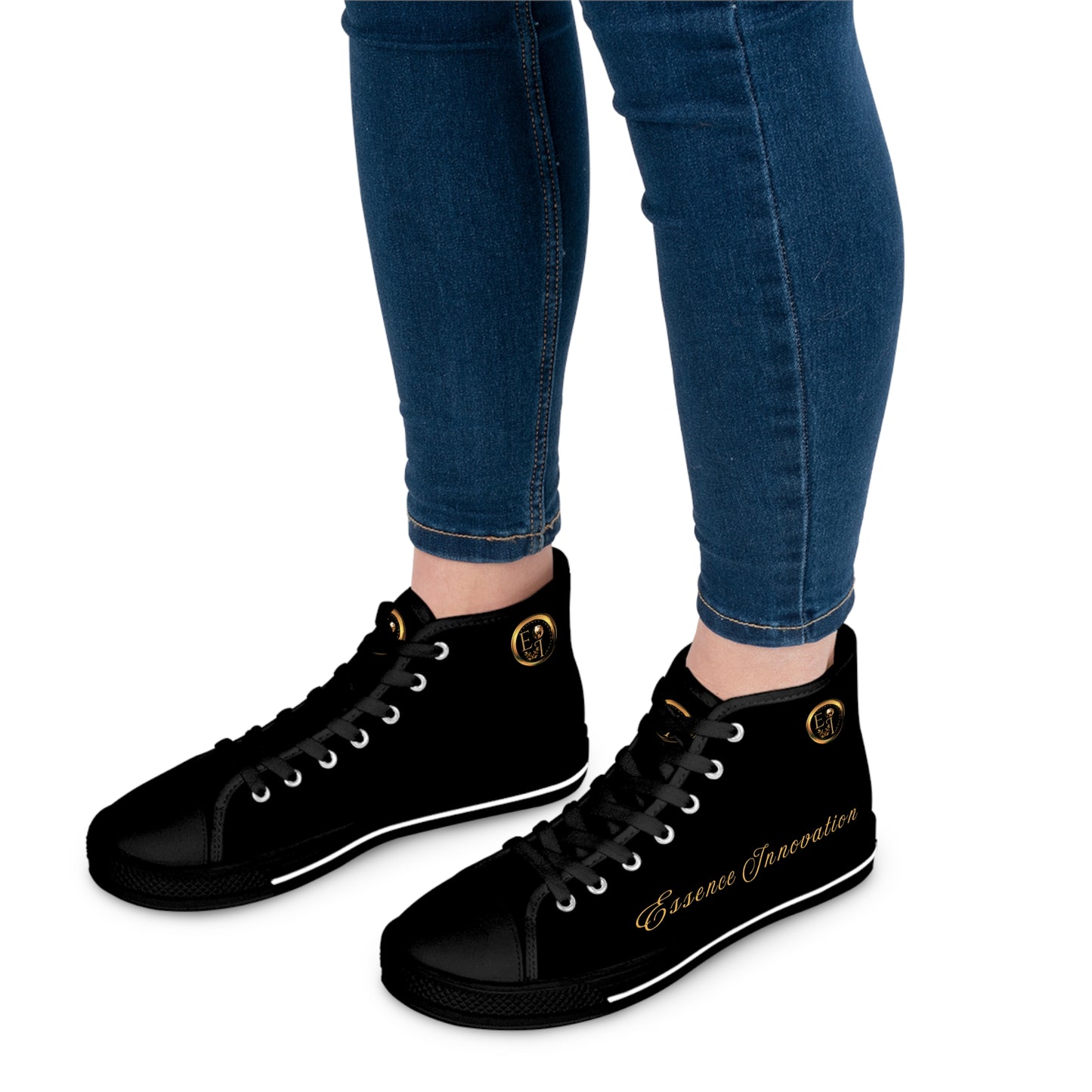 Black high-top 'Essence Innovation' sneakers with a design on the side, worn with blue jeans.