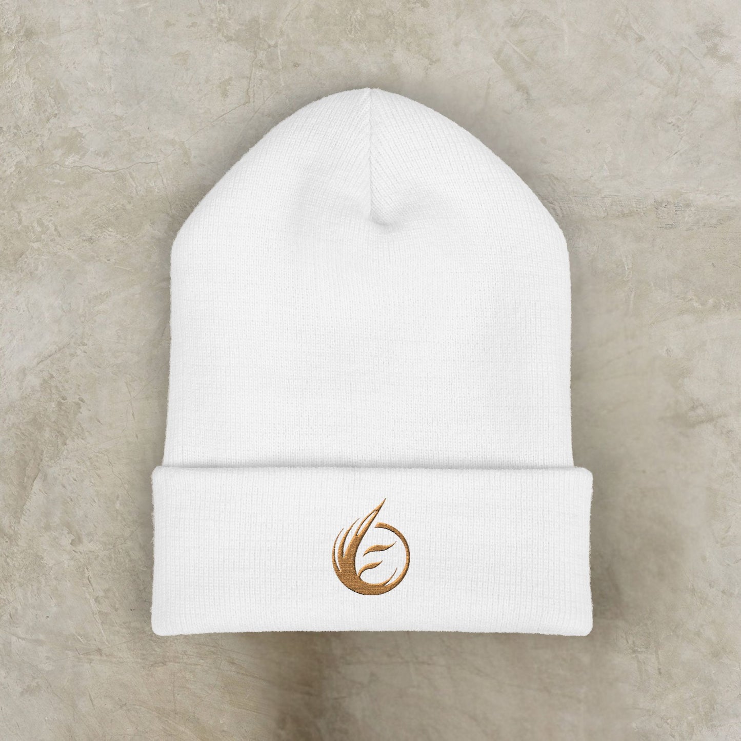 White beanie with a gold EssenceInnoCreate logo on a beige background