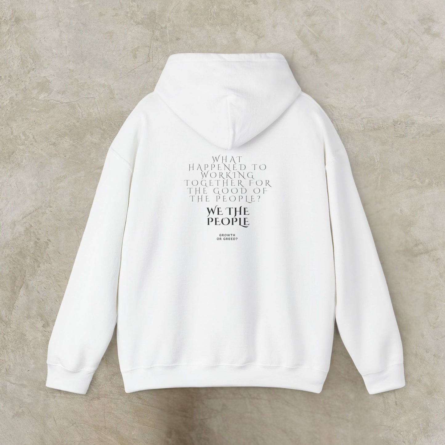 White EssenceInnoCreate Quiet Resolve hoodie with text on the back against a beige background