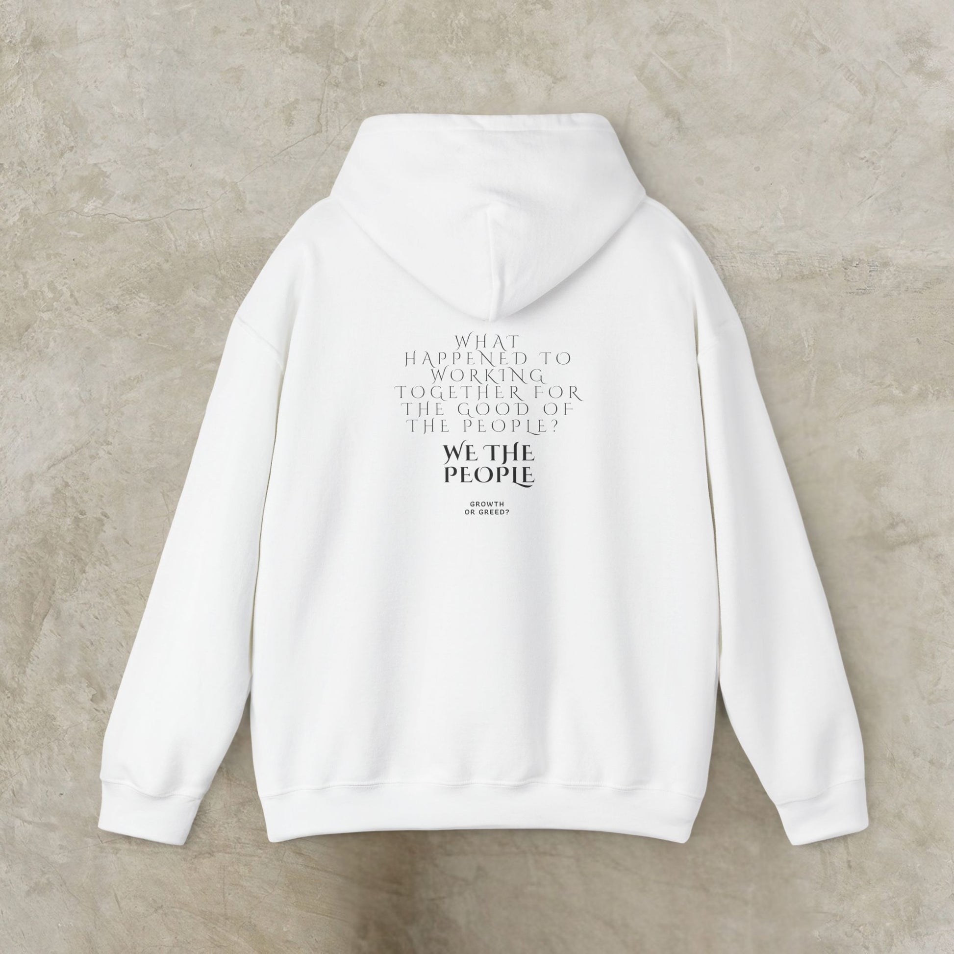 White EssenceInnoCreate Quiet Resolve hoodie with text on the back against a beige background