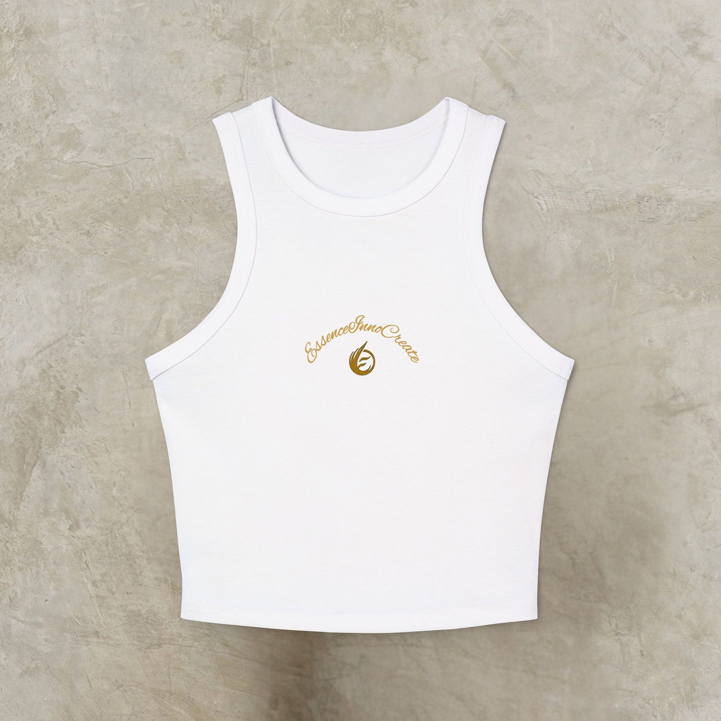 White tank top with a gold EssenceInnoCreate logo on a beige background