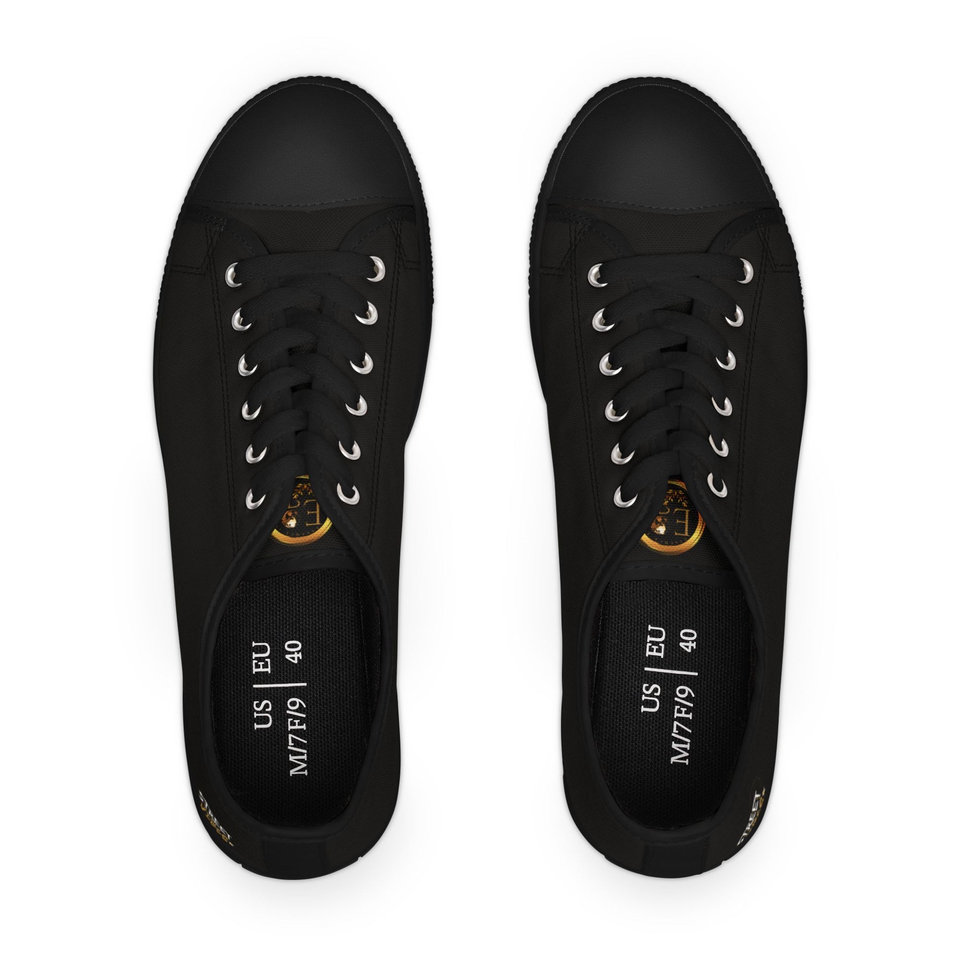 Black sneakers with gold Essence Innovation 'Street Vibes' accents on a white background