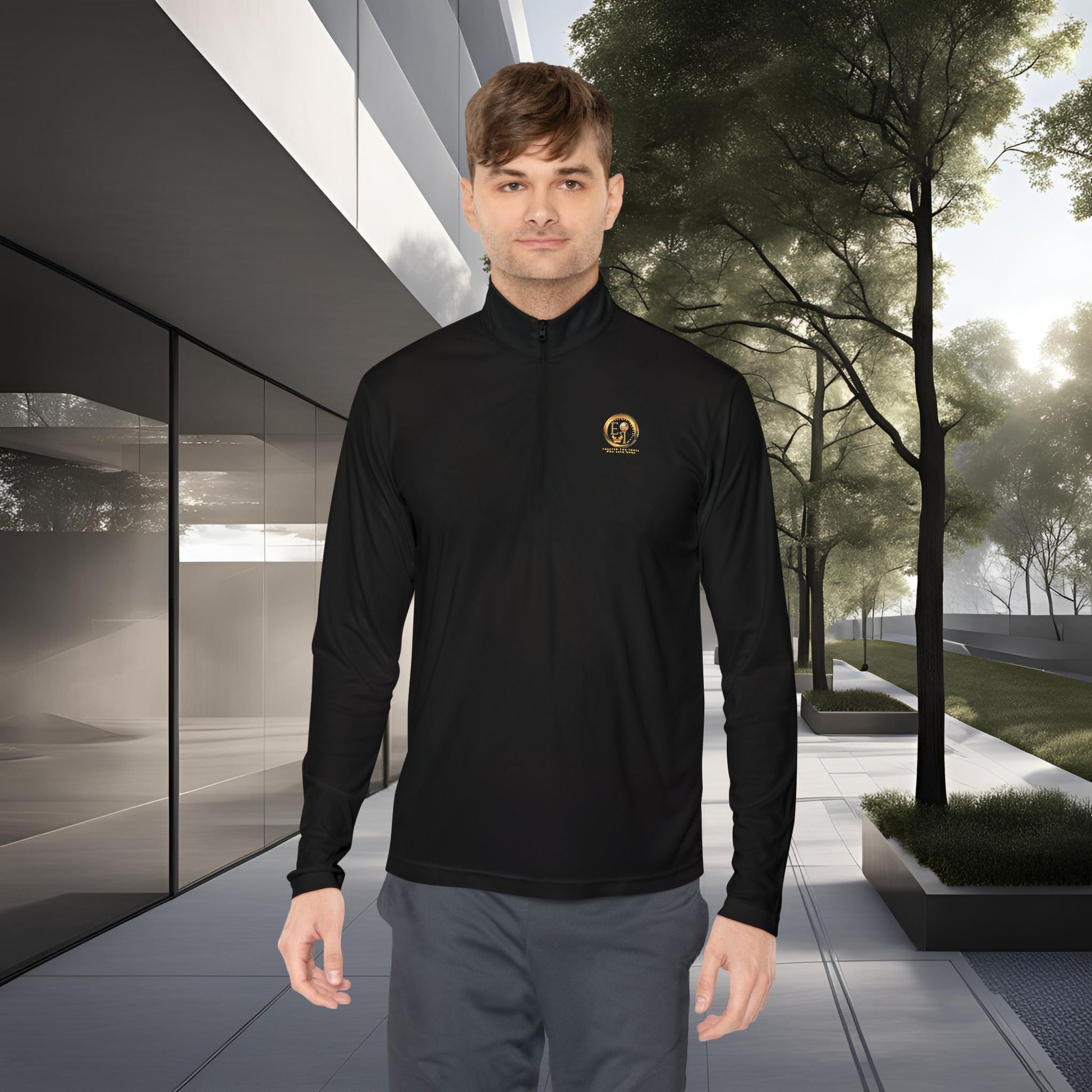 Man wearing a black Essence Innovation Seek More long-sleeve shirt with a logo in an urban setting