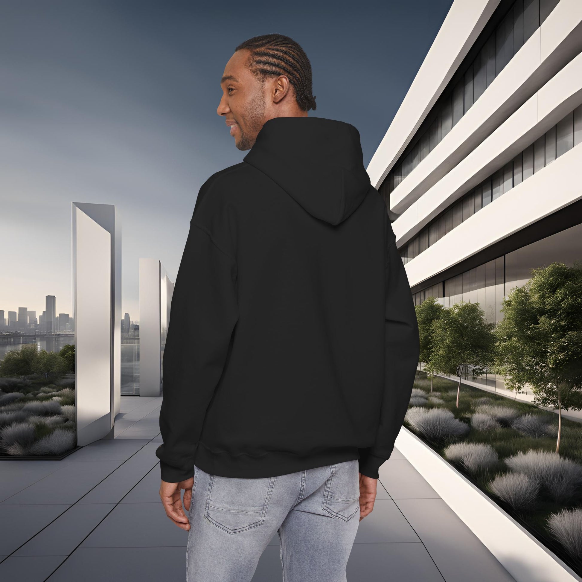 Person wearing a black 'EssenceInnoCreate' hoodie standing on a modern rooftop with cityscape in the background