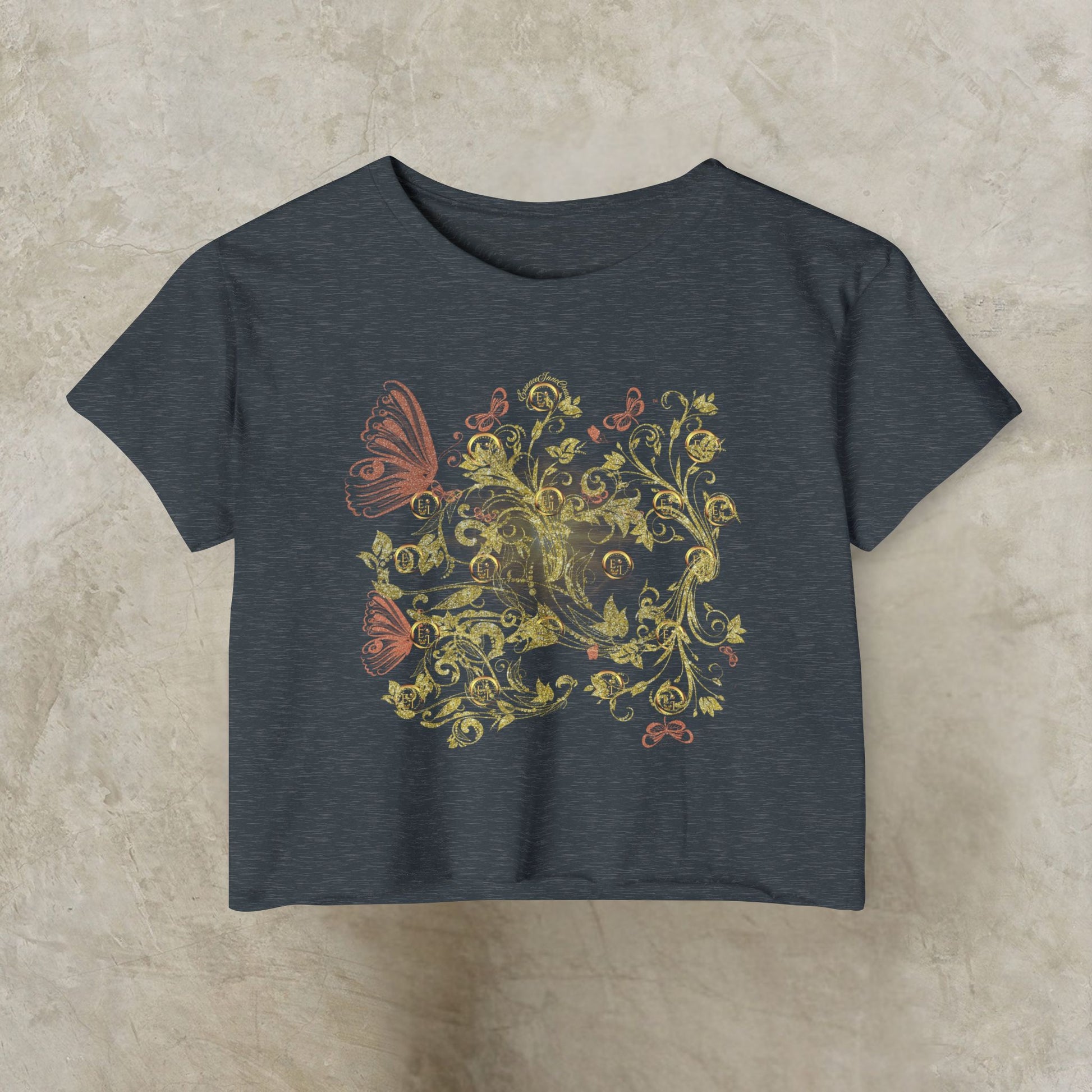 Dark gray t-shirt with Essence Innovation Bohemian Butterfly and floral design on a beige background
