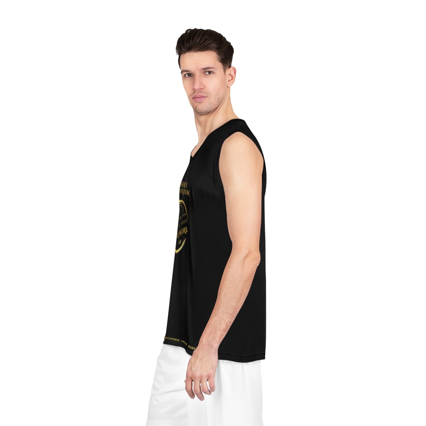 Man wearing a black sleeveless shirt with gold designs on a white background
