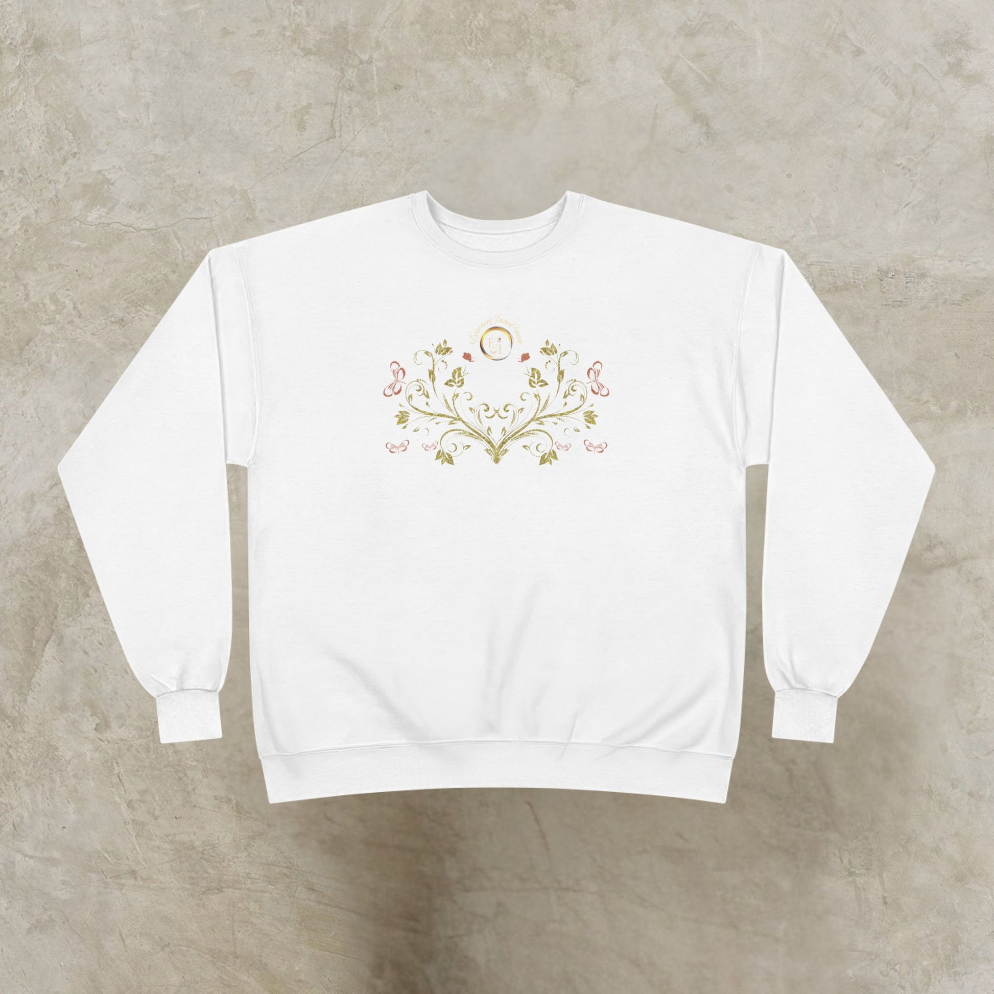 White sweatshirt with a decorative Essence Innovation Bohemian Butterfly Crest design on a gray background
