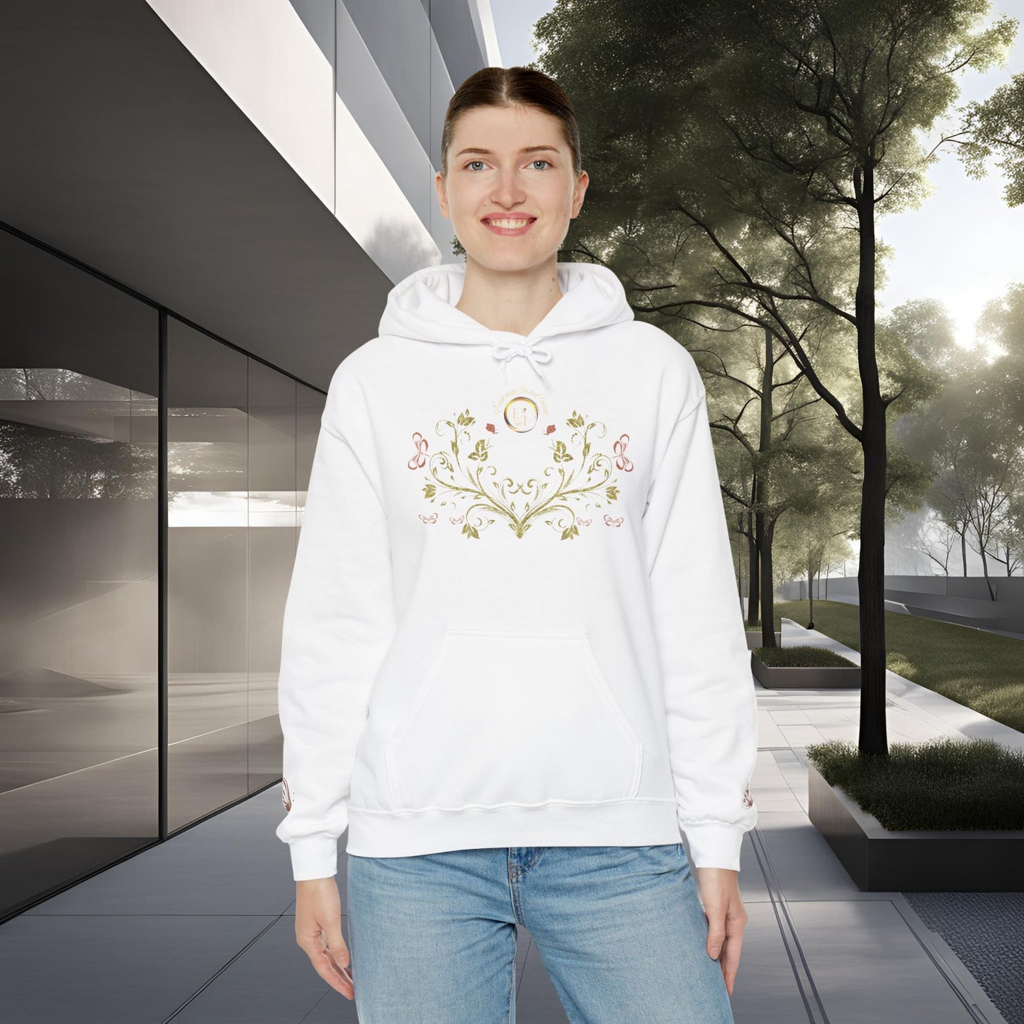 Person wearing a white hoodie with a floral Essence Innovation Bohemian Butterfly Crest design in an outdoor setting