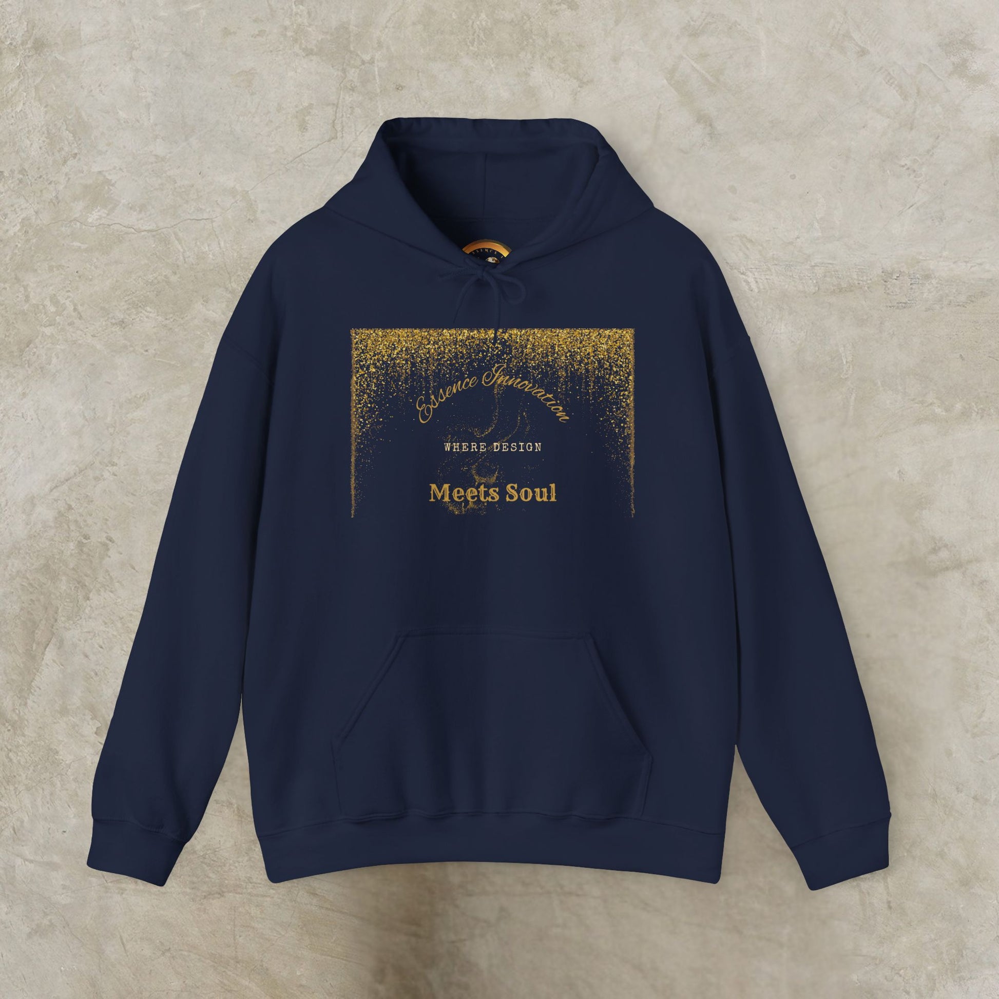Navy blue hoodie with gold Essence Innovation 'Design Meets Soul' text on a beige background