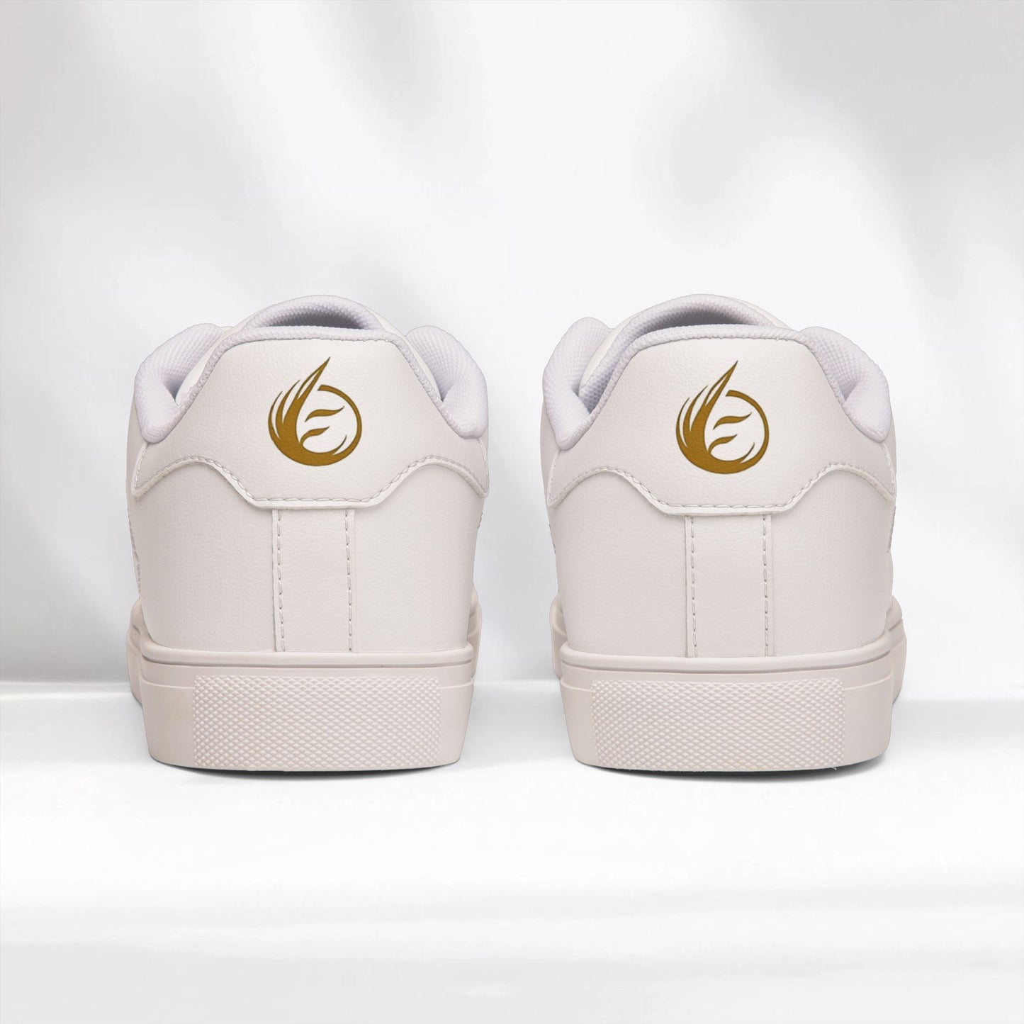 White EssenceInnoCreate sneakers with gold logo on a white background