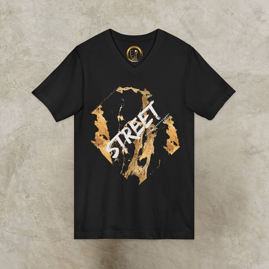 Black EssenceInnoCreate t-shirt with gold and white graphic design on a textured beige background