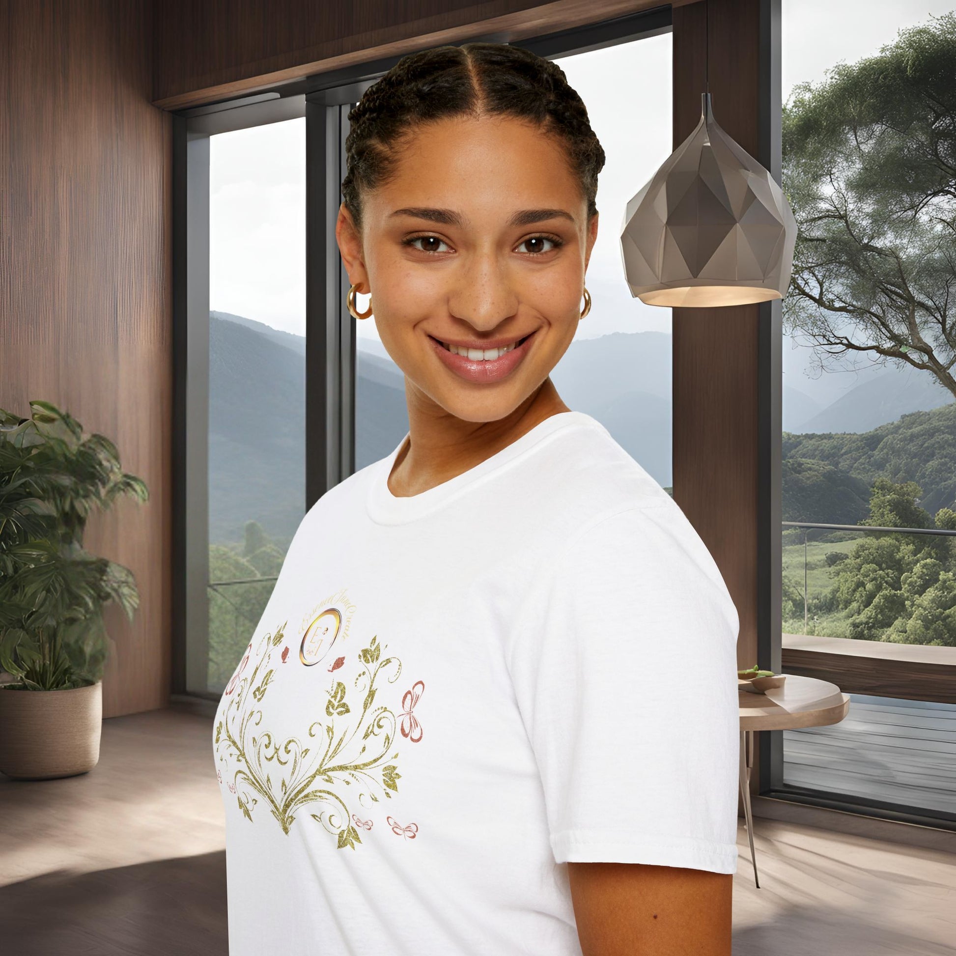 Woman wearing a white t-shirt with Essence Innovation Bohemian Butterfly floral design in a modern room with large windows.