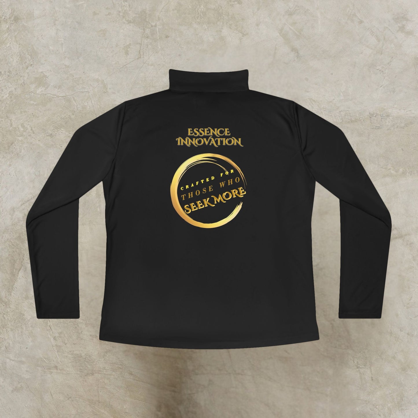 Black long-sleeve Essence Innovation Seek More quarter-zip shirt with gold text on a textured beige background