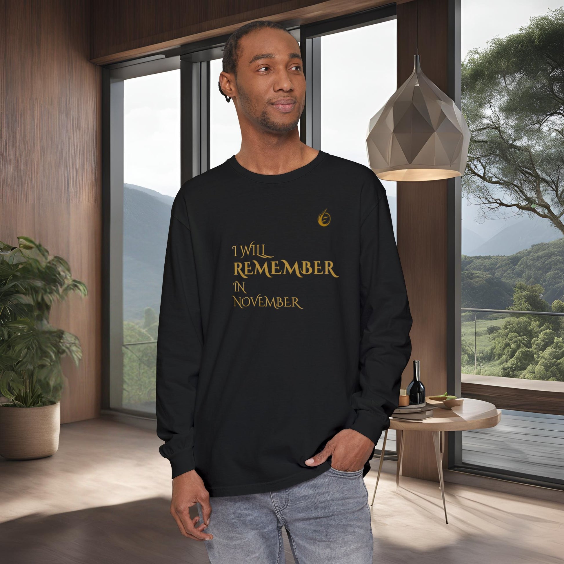Man wearing a black long-sleeve shirt with EssenceInnoCreate Quiet Resolve text in a modern room with large windows.