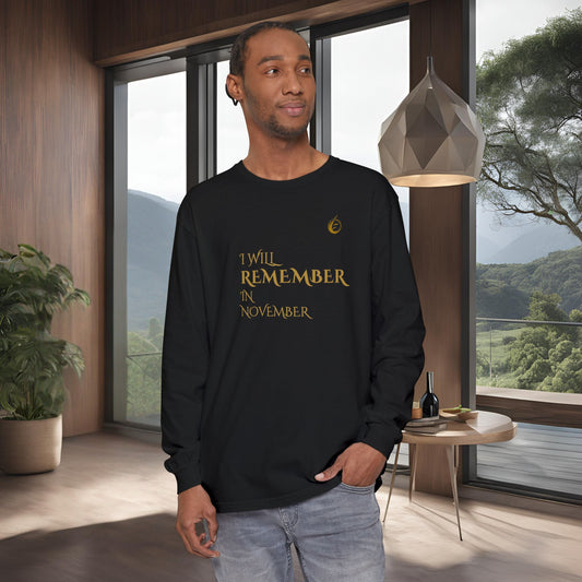 Man wearing a black long-sleeve shirt with EssenceInnoCreate Quiet Resolve text in a modern room with large windows.
