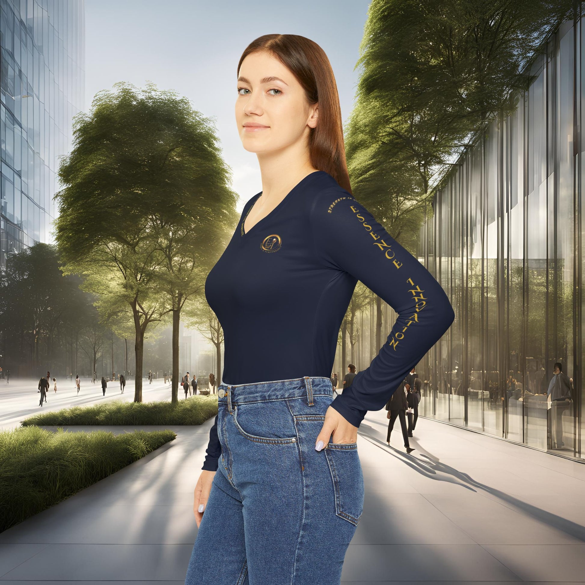 Woman in a blue Essence Innovation outfit standing in an urban setting with modern buildings and trees.