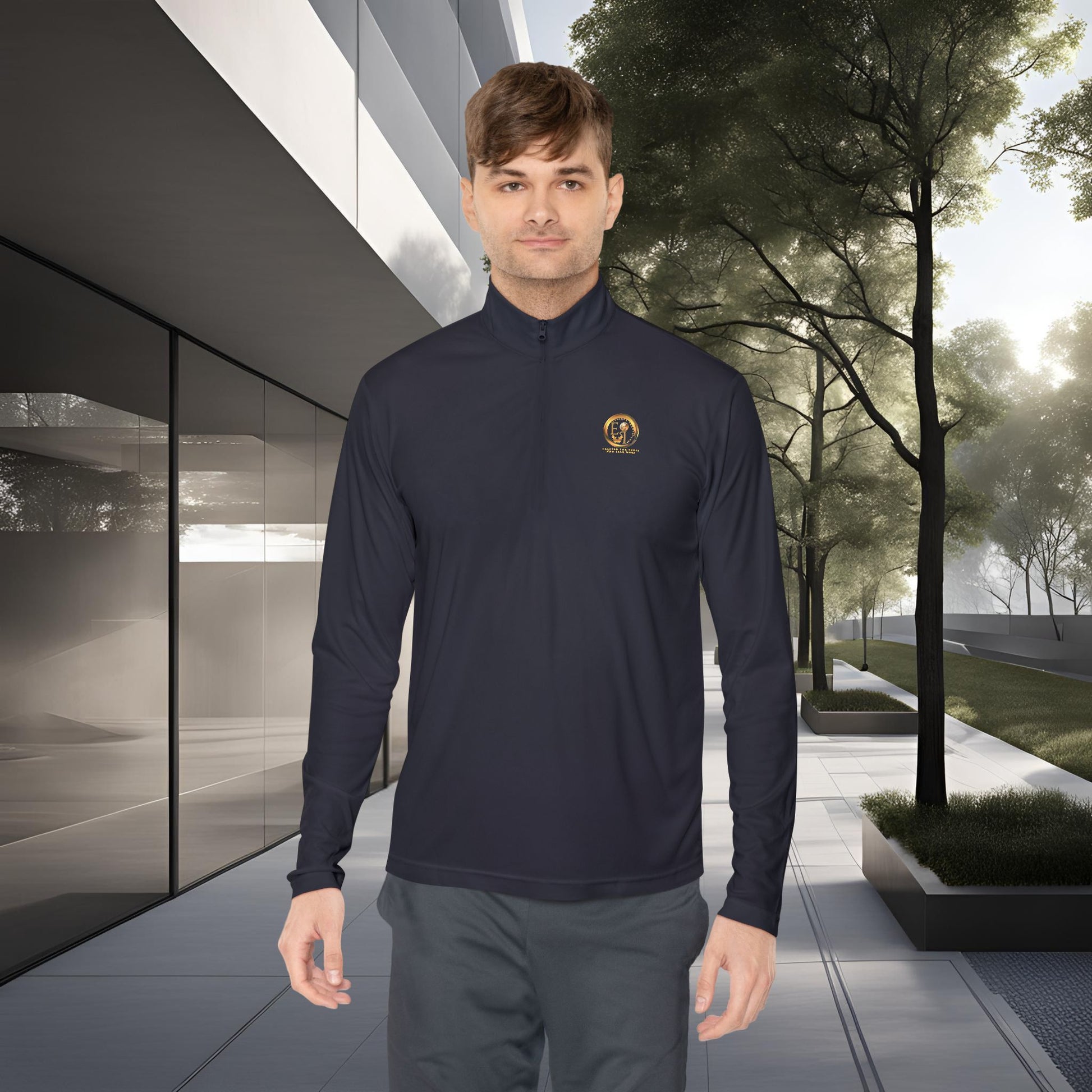 Man wearing a navy Essence Innovation Seek More long-sleeve shirt with a logo in an outdoor setting