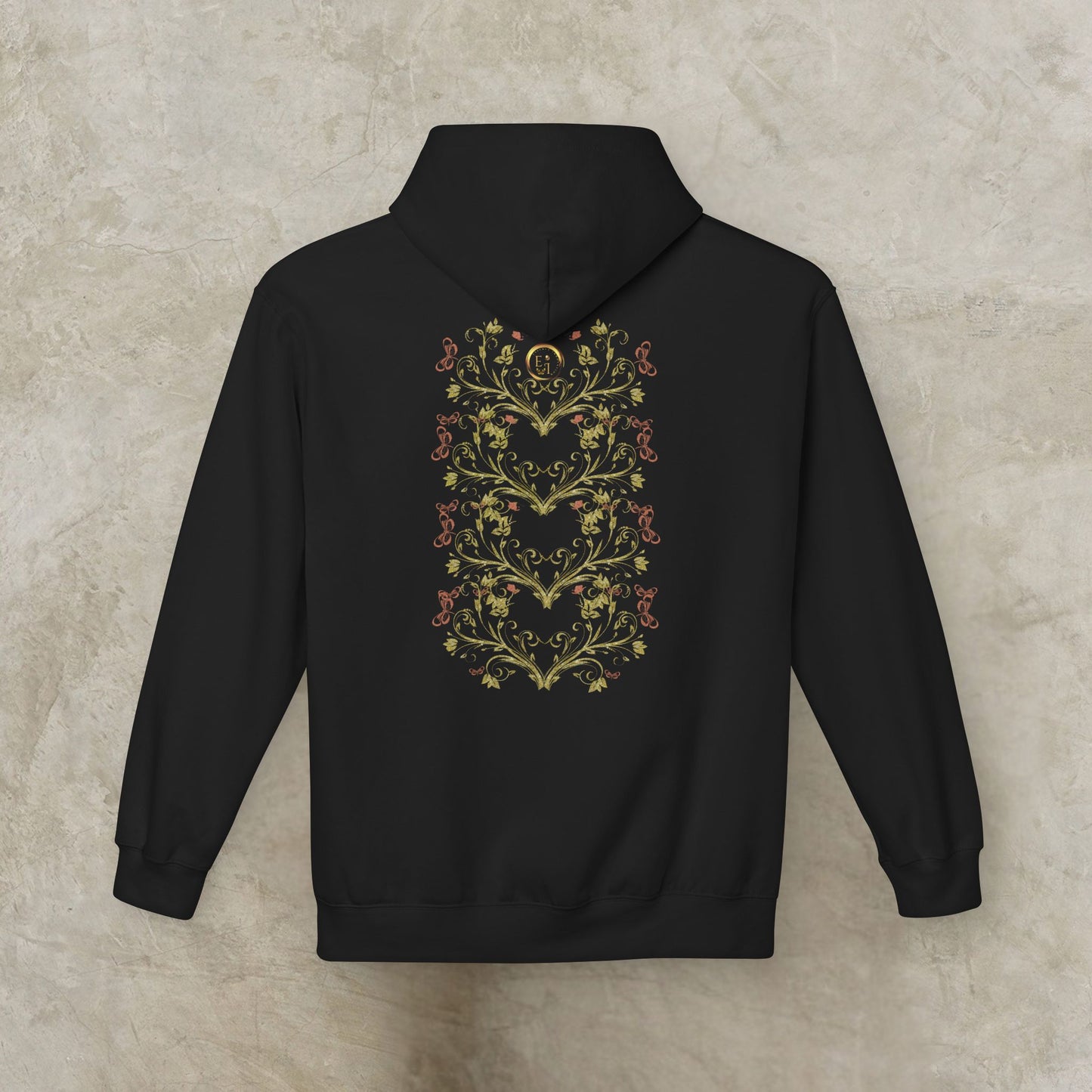Black Essence Innovation Bohemian Butterfly hoodie with floral heart design on the back against a beige background