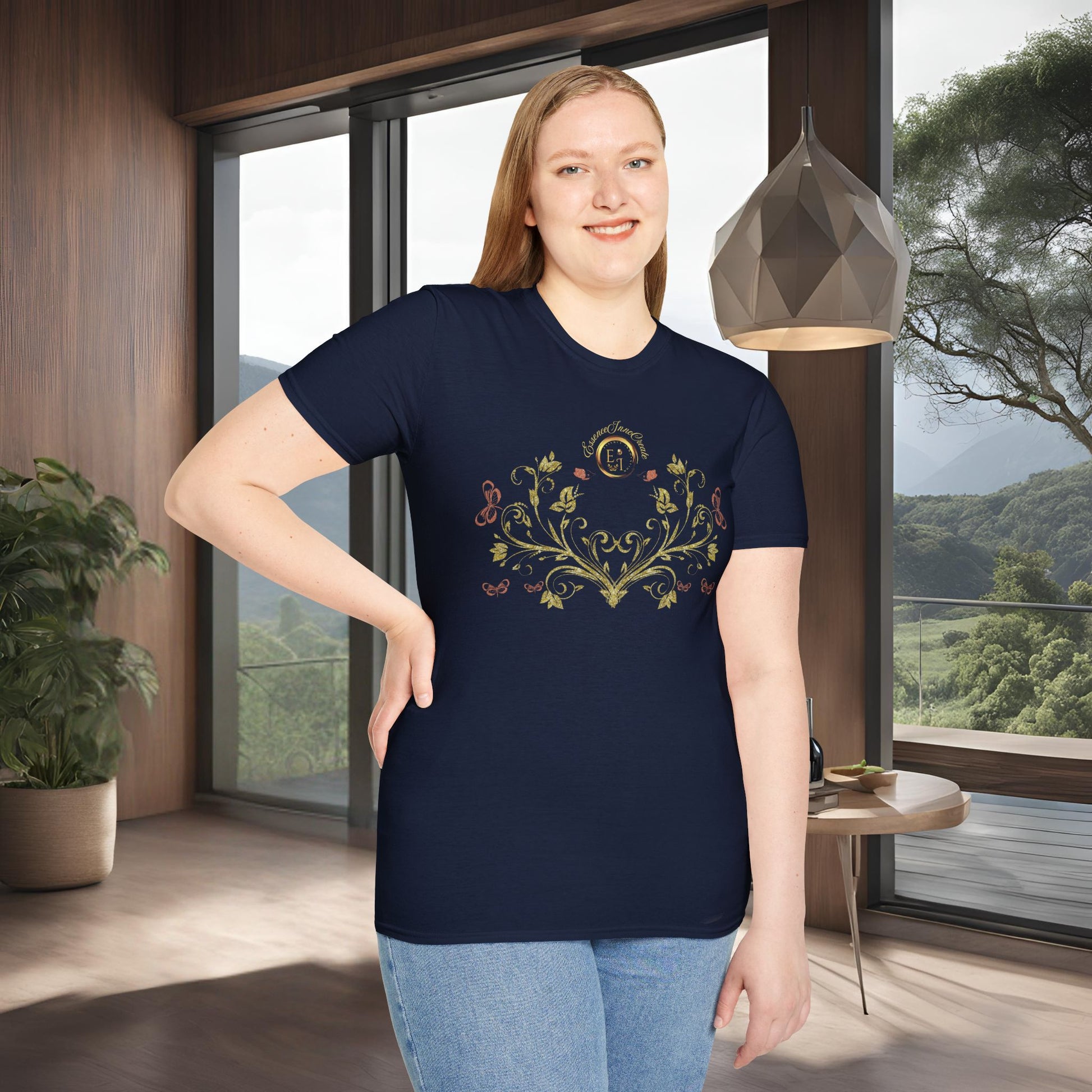 Woman wearing a navy blue t-shirt with a Essence Innovation Bohemian Butterfly floral design in a modern room with large windows.