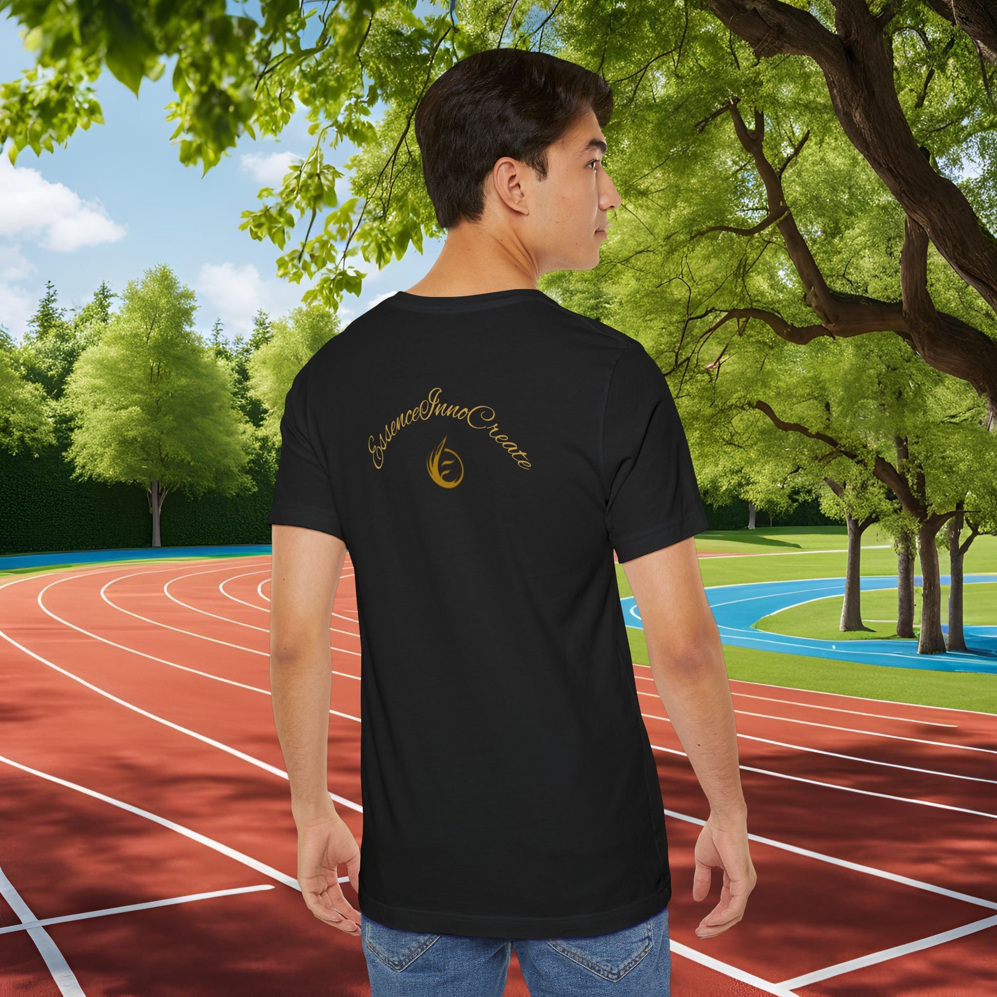 Person wearing a black t-shirt with text 'EssenceInnoCreate' on the back, standing on a running track with greenery in the background
