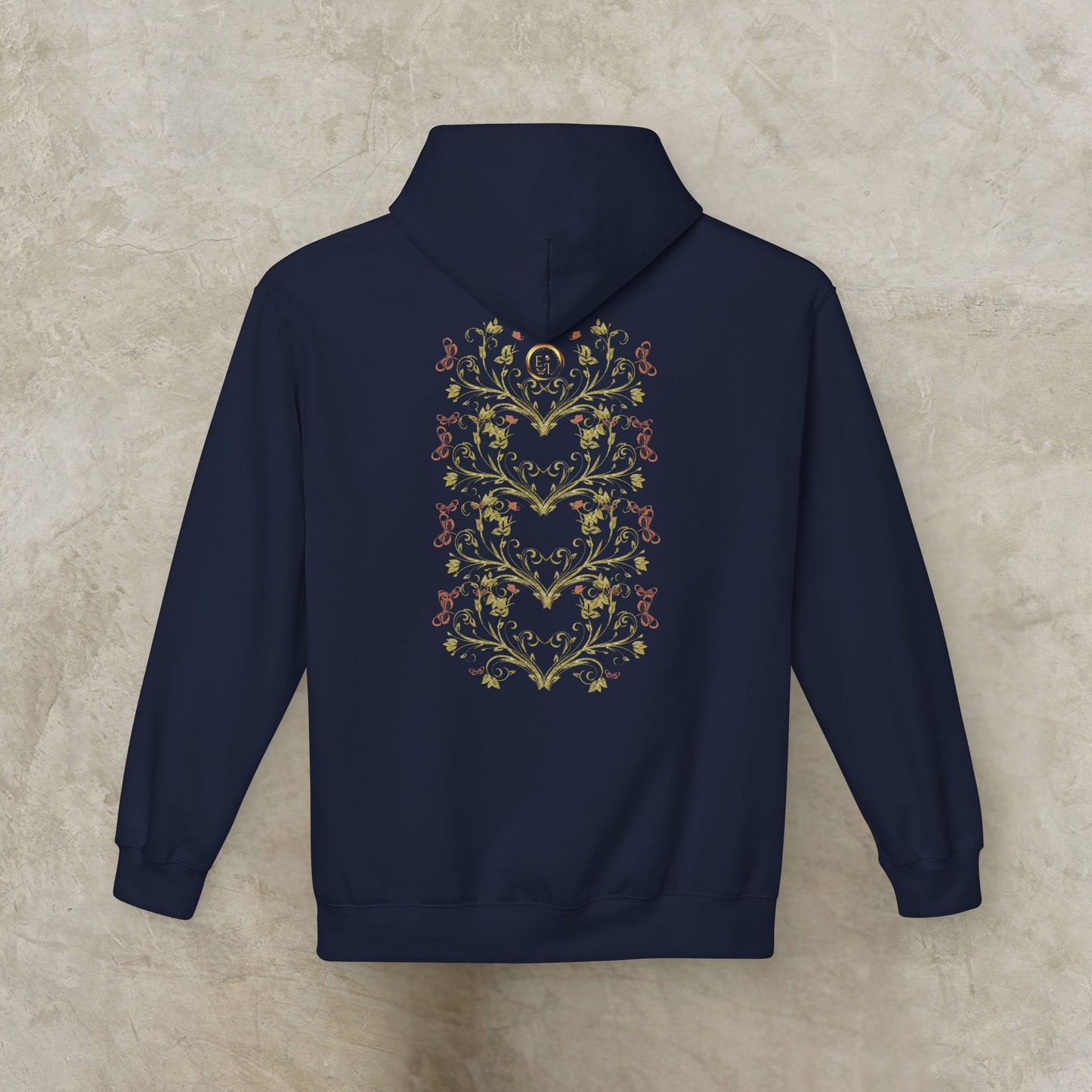 Navy blue hoodie with Essence Innovation Bohemian Butterfly floral heart design on the back against a beige background