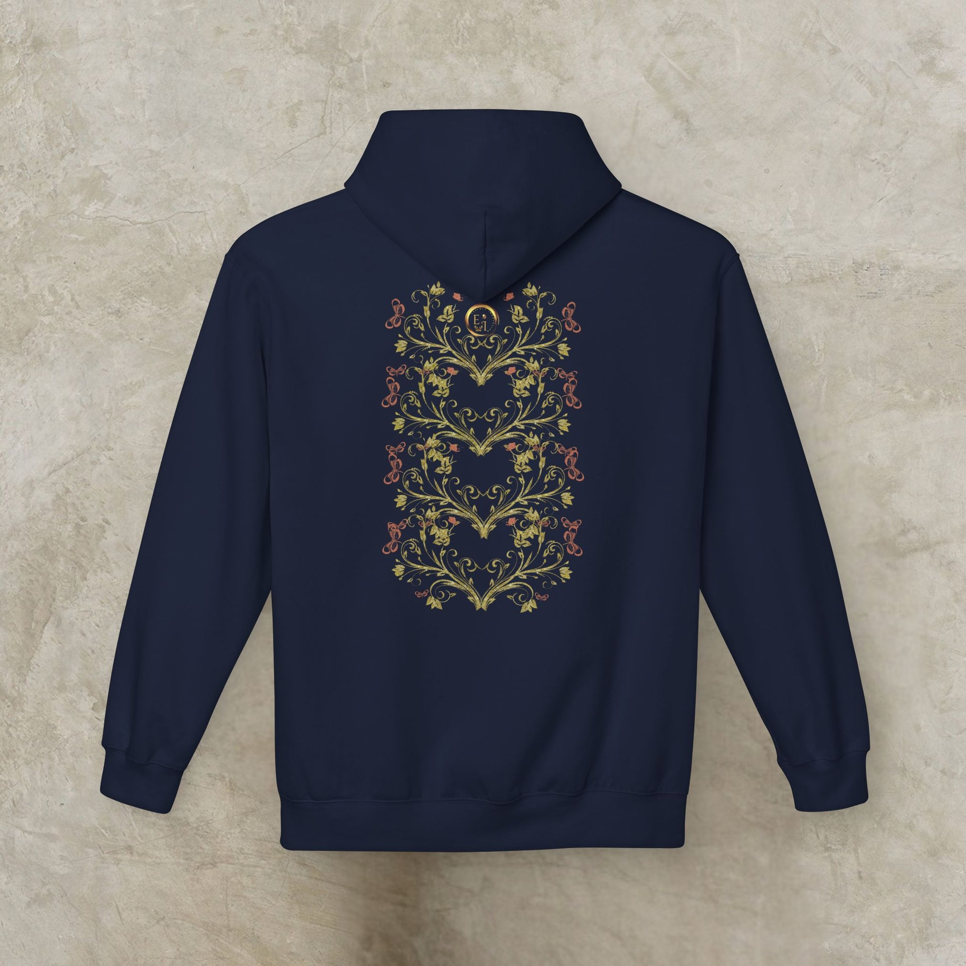 Navy blue hoodie with Essence Innovation Bohemian Butterfly floral heart design on the back against a beige background
