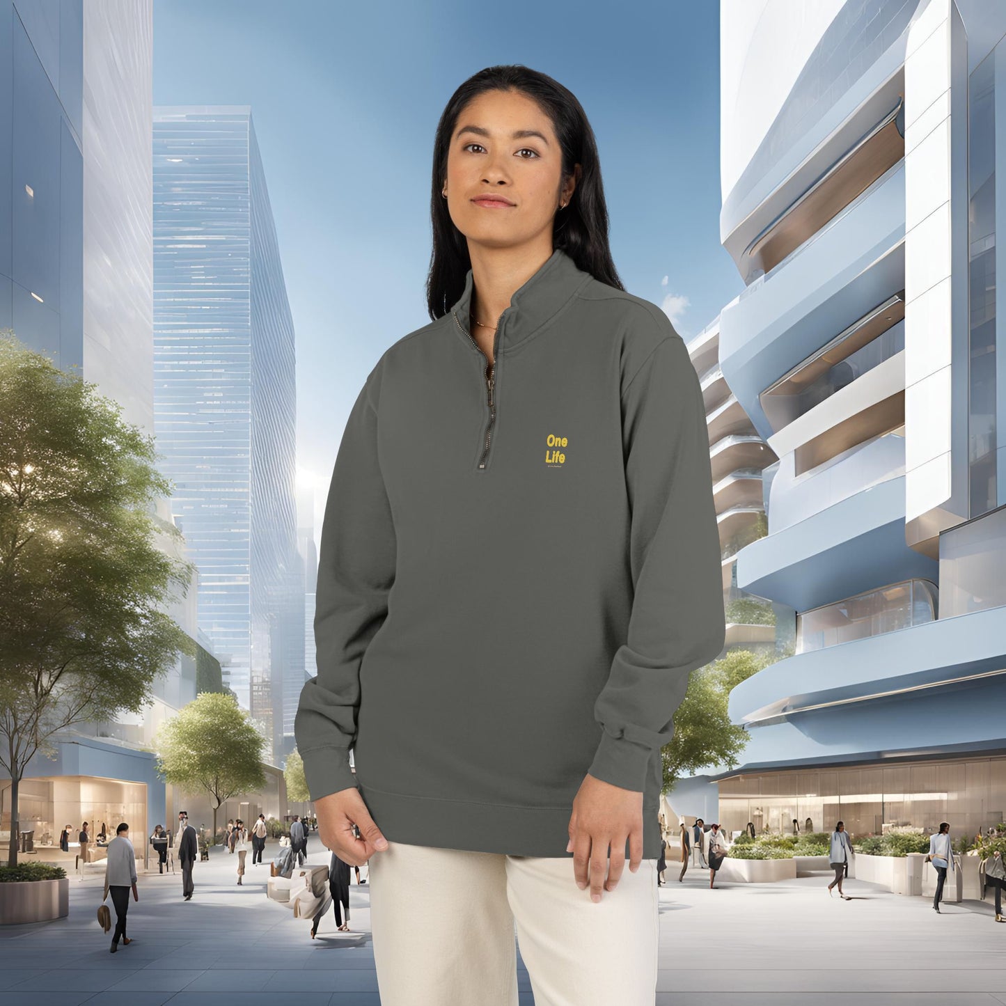 Person wearing a gray sweatshirt with a One Life logo in an urban setting
