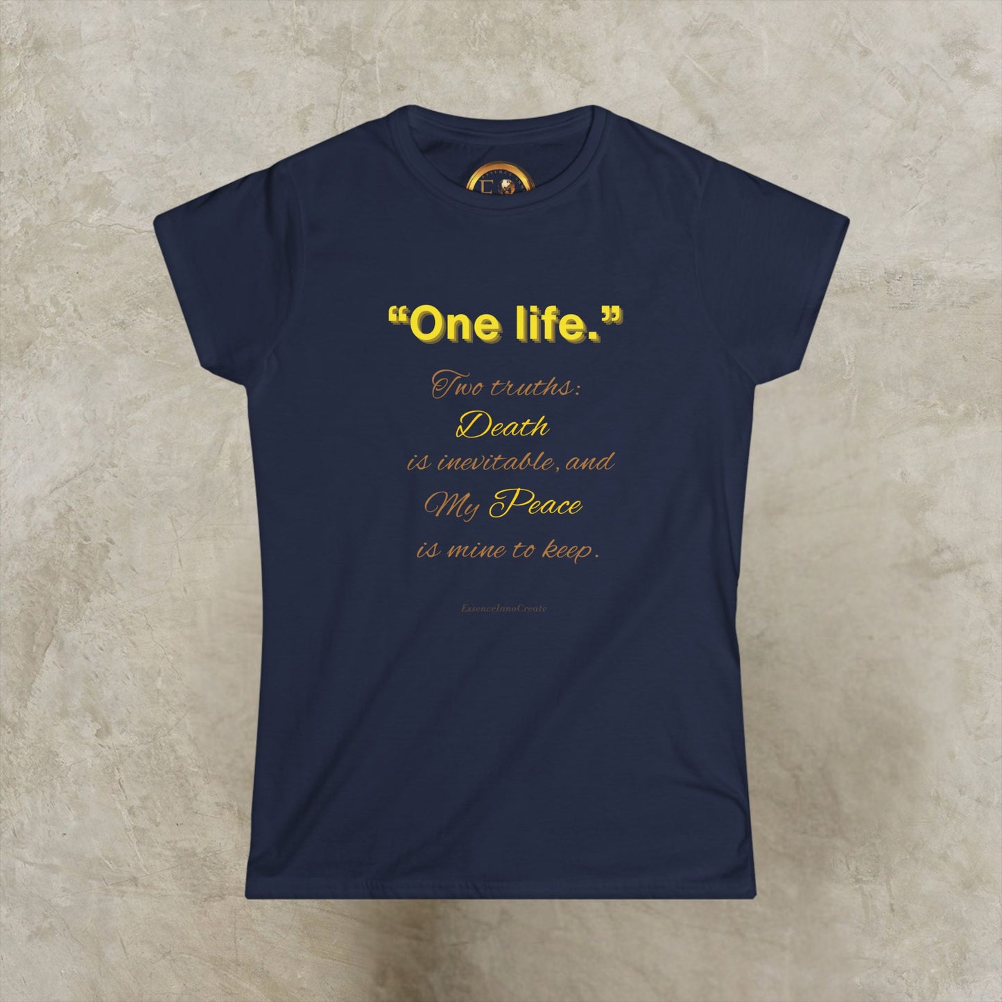 Black t-shirt with decorative One Life design on a beige background