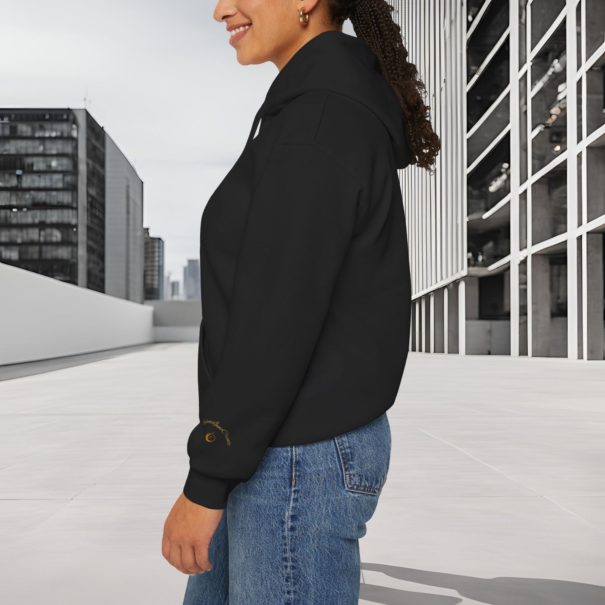 Person wearing a black 'EssenceInnoCreate' hoodie with a cityscape background