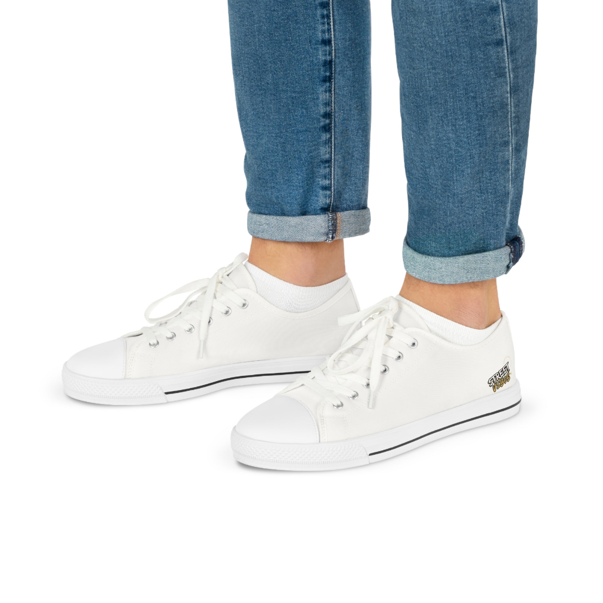 White Essence Innovation 'Street Vibes' sneakers worn with rolled-up blue jeans on a white background