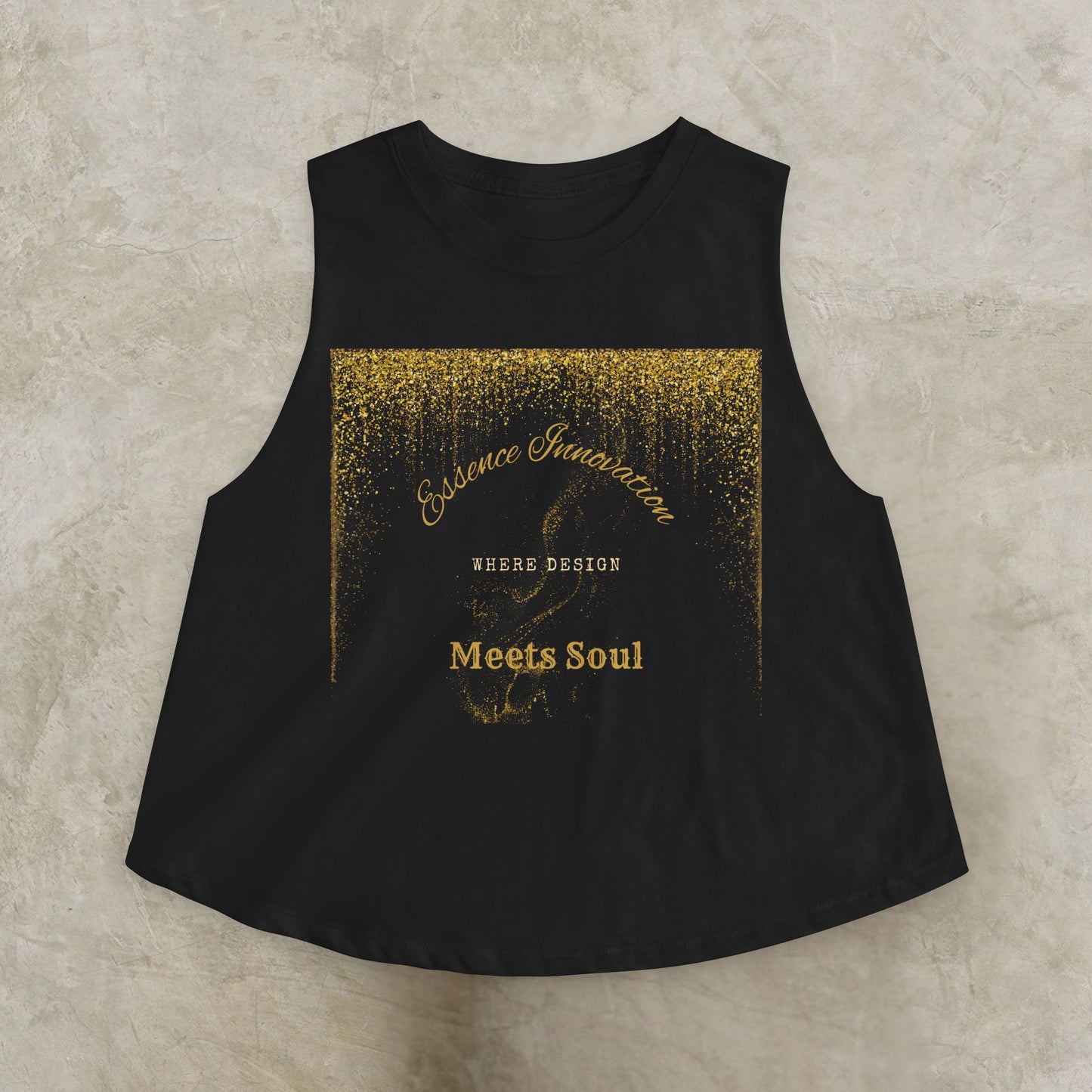 Black sleeveless top with gold Essence Innovation 'Design Meets Soul' text on a textured beige background