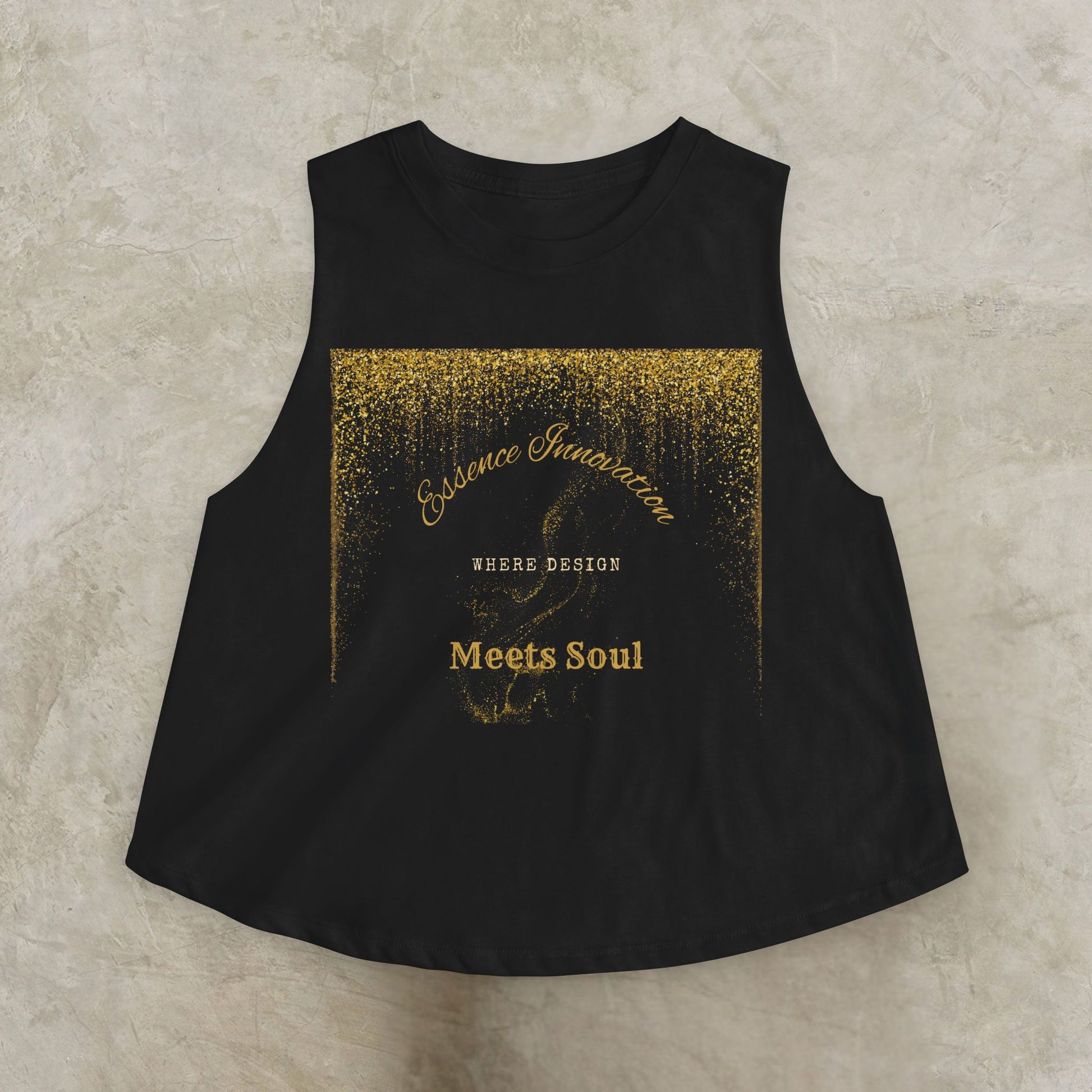Black sleeveless top with gold Essence Innovation 'Design Meets Soul' text on a textured beige background