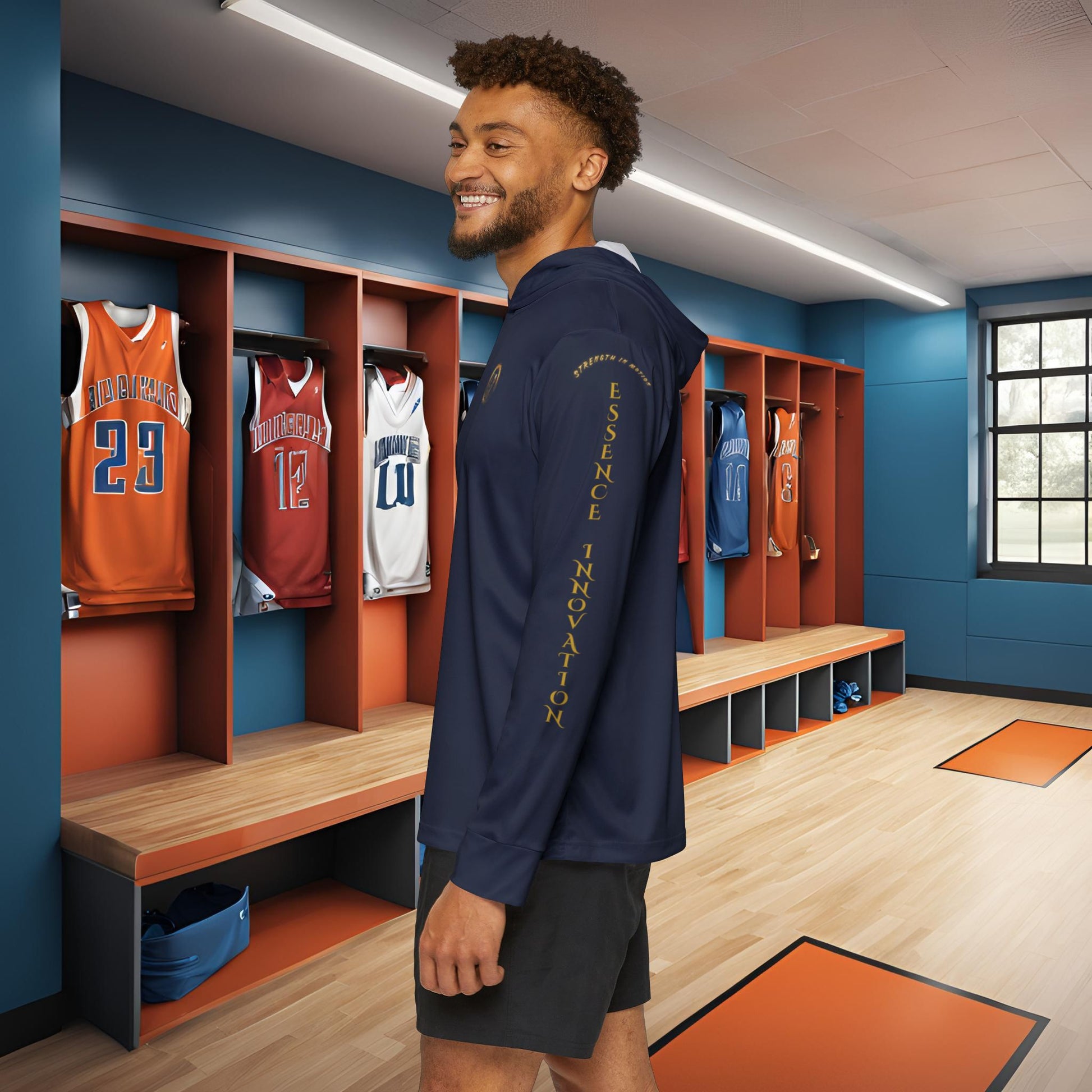 Man standing in a locker room with Essence Innovation Seek More sports hoodie on the wall