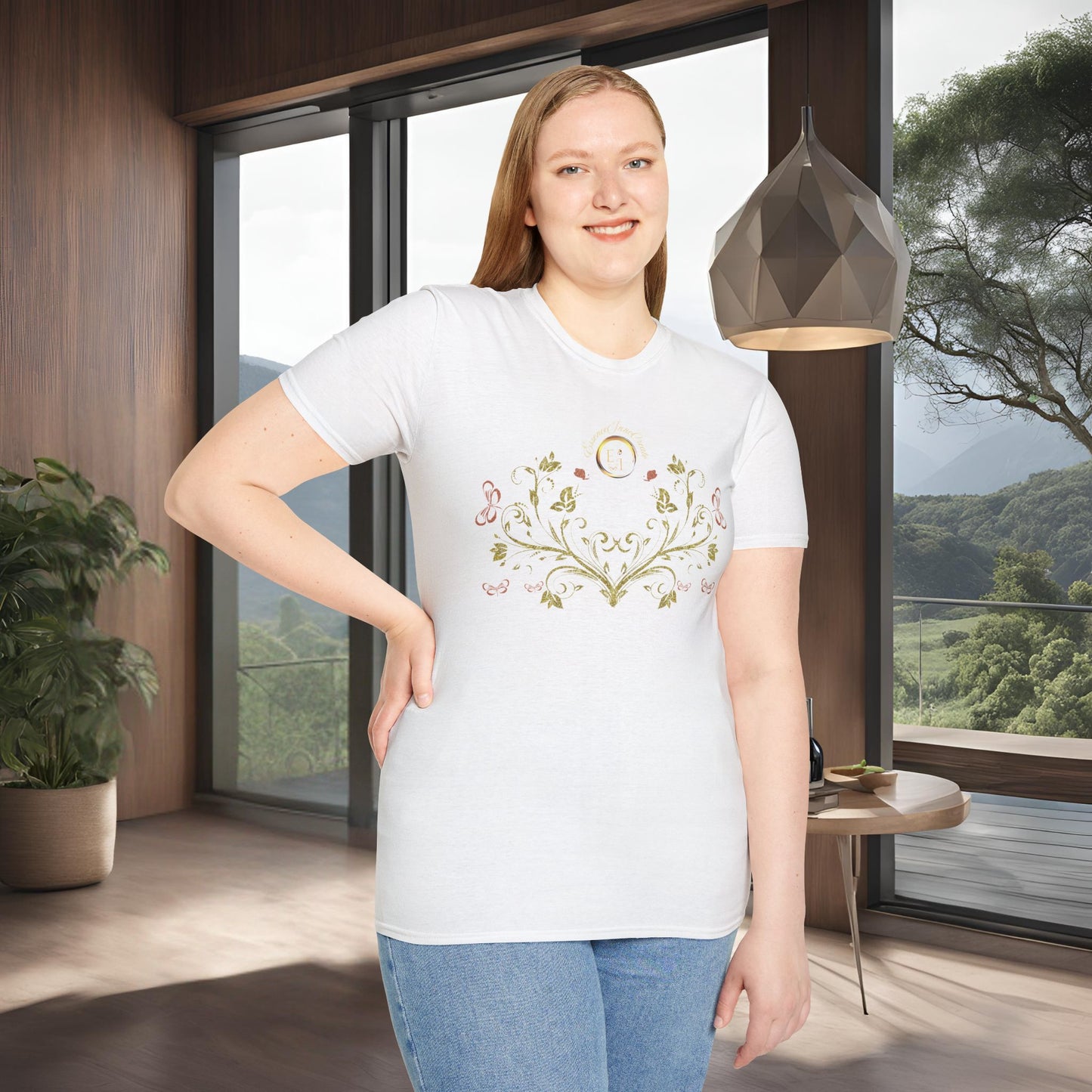 Woman wearing a white t-shirt with a Essence Innovation Bohemian Butterfly floral design in a modern room with large windows.