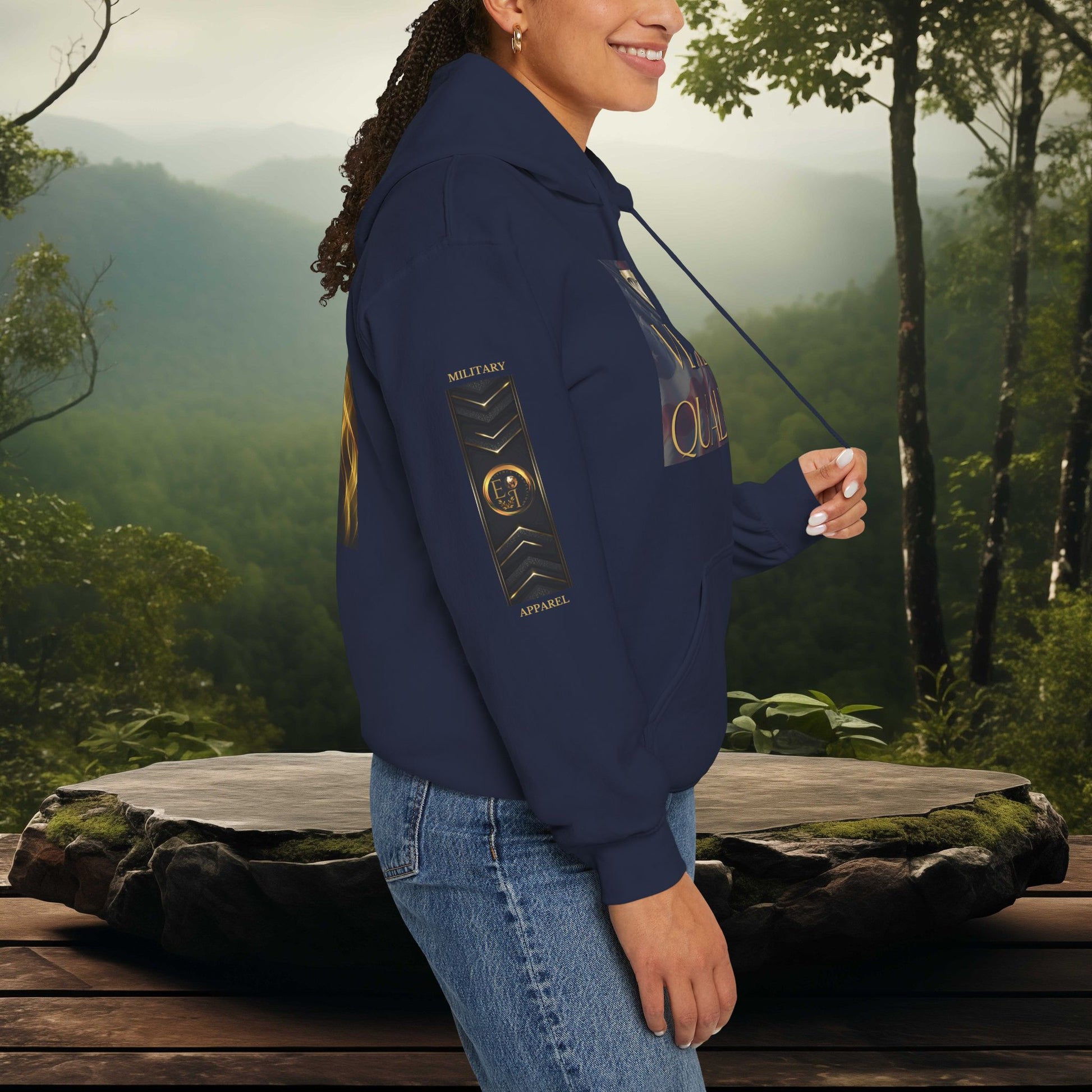 Person wearing a navy Essence Innovation hoodie with a scenic background