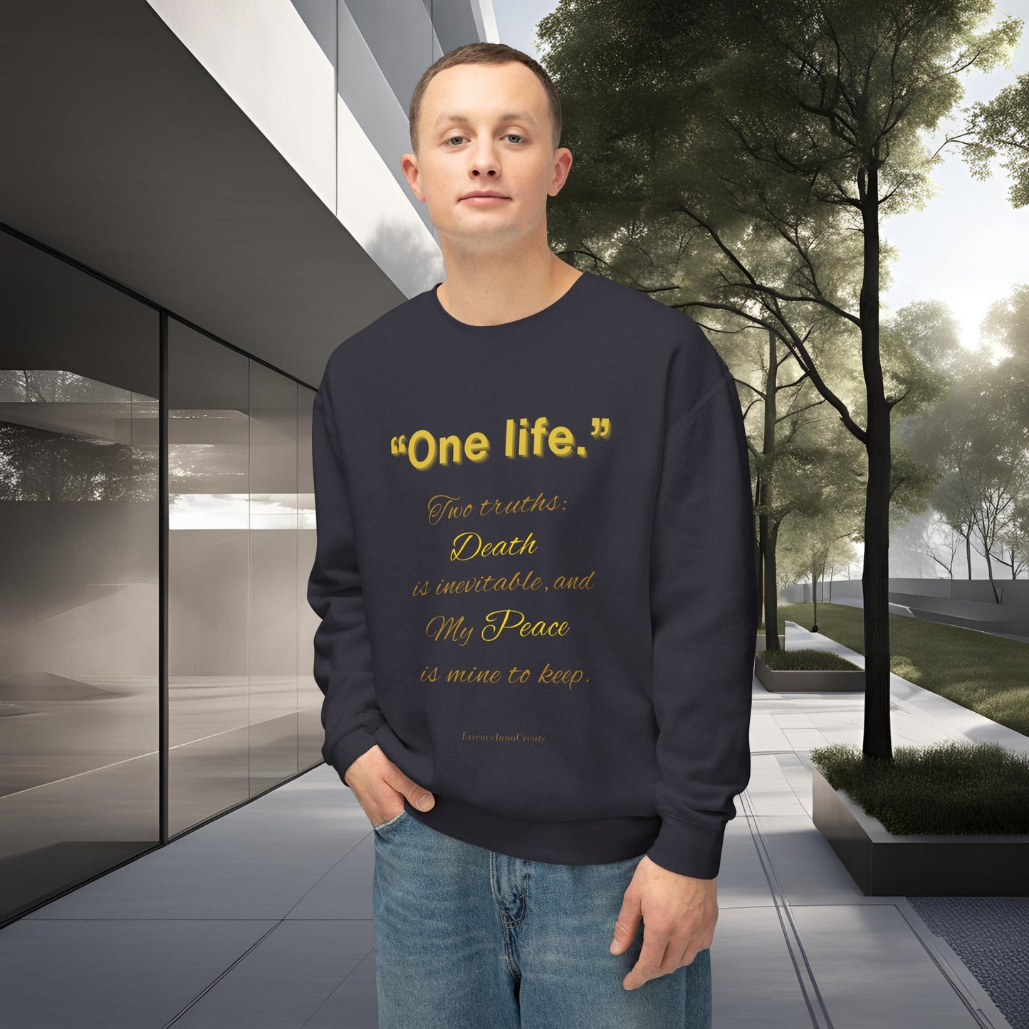 Man wearing a dark blue sweatshirt with yellow One Life text in an outdoor setting