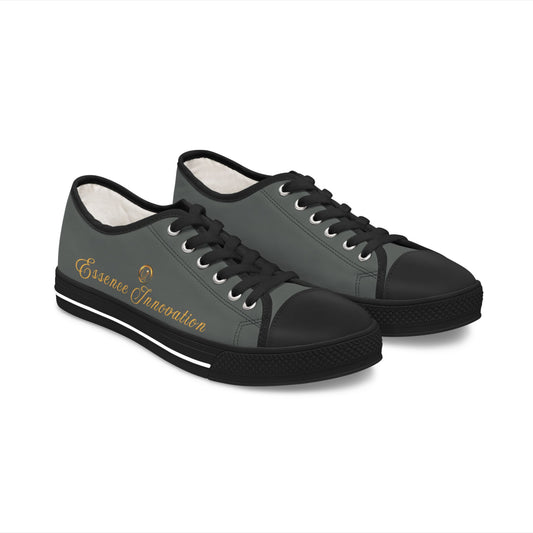Pair of black and gray 'Essence Innovation' sneakers with a visible brand logo on a white background