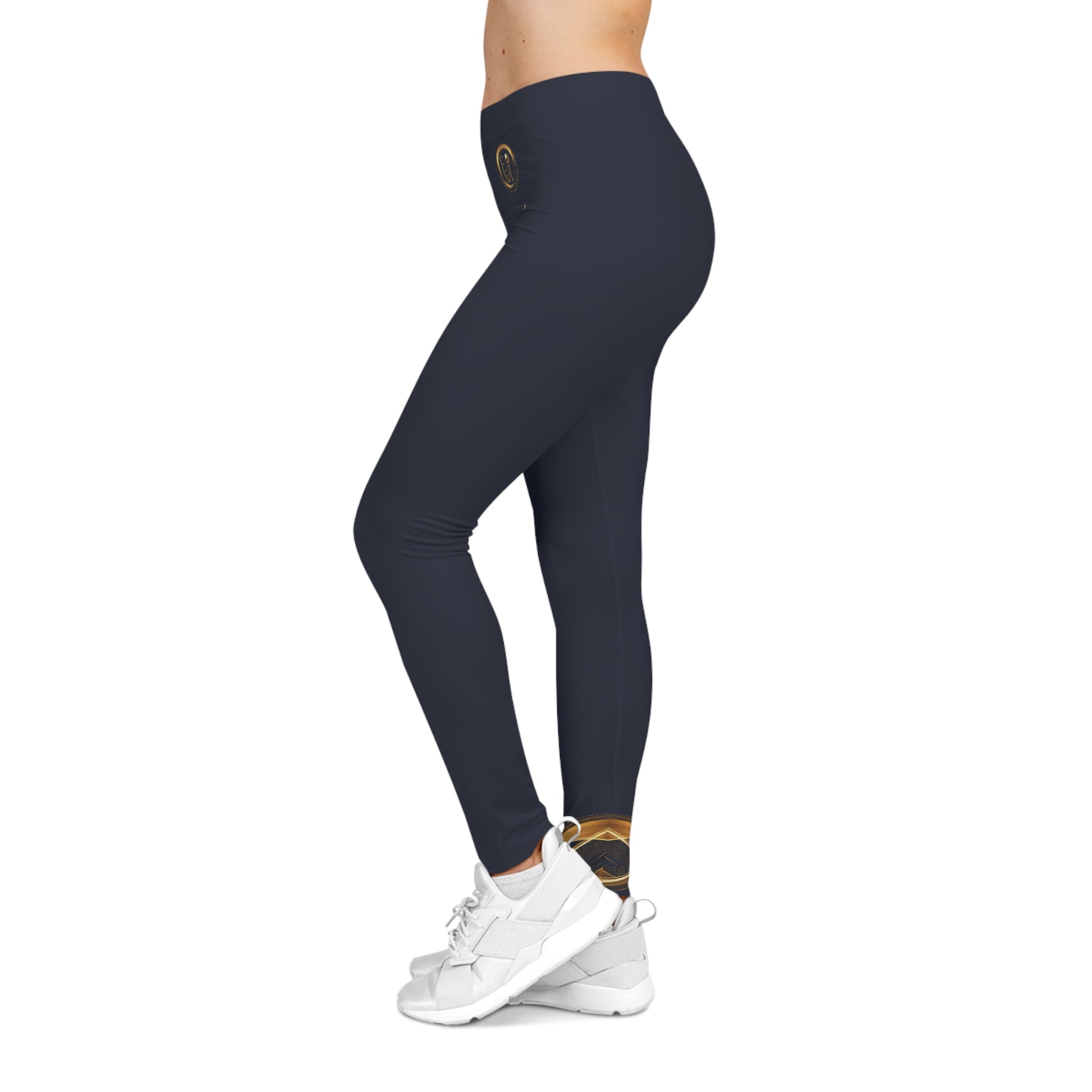 Navy leggings worn by a person on a white background