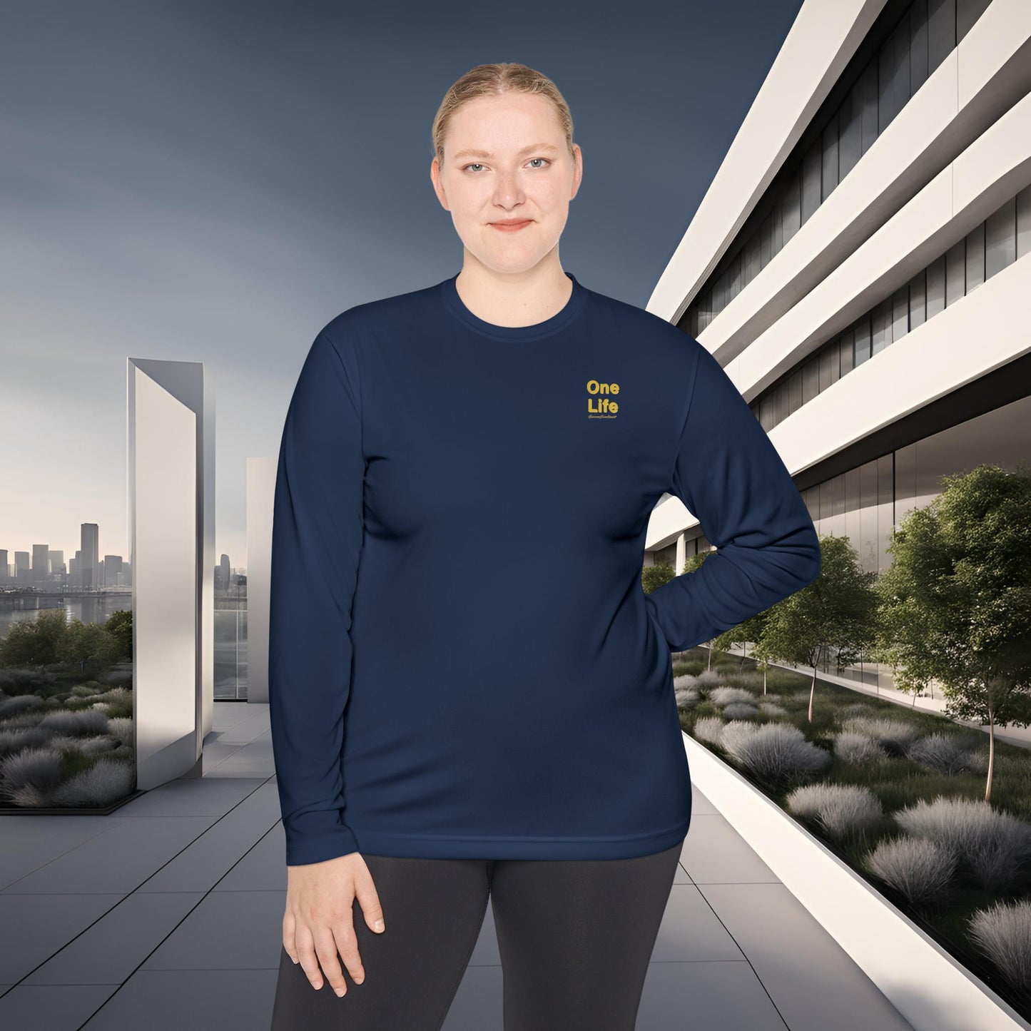 Person wearing a navy blue long-sleeve shirt with a One Life logo in an urban setting