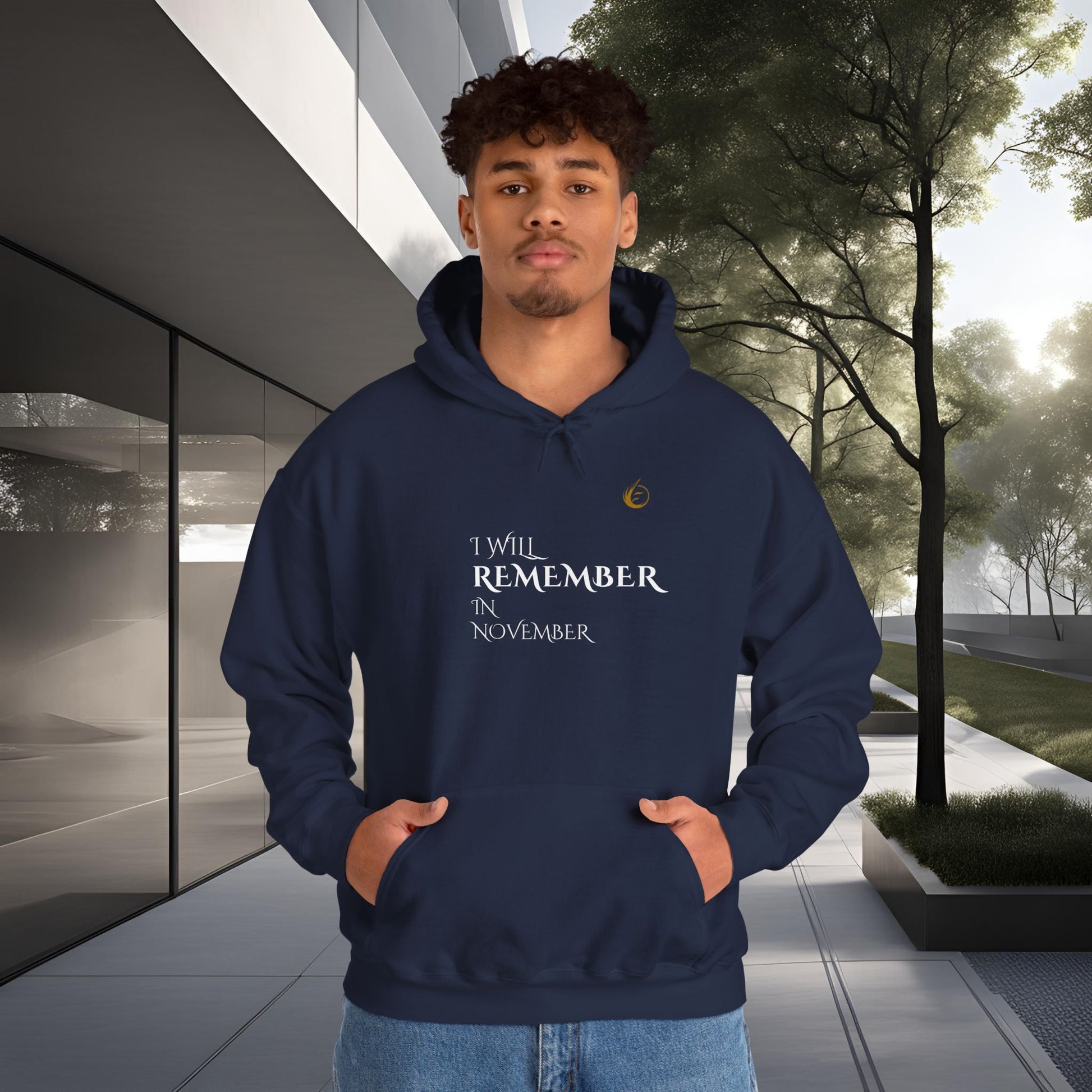 Person wearing a navy EssenceInnoCreate Quiet Resolve hoodie with text standing outdoors.
