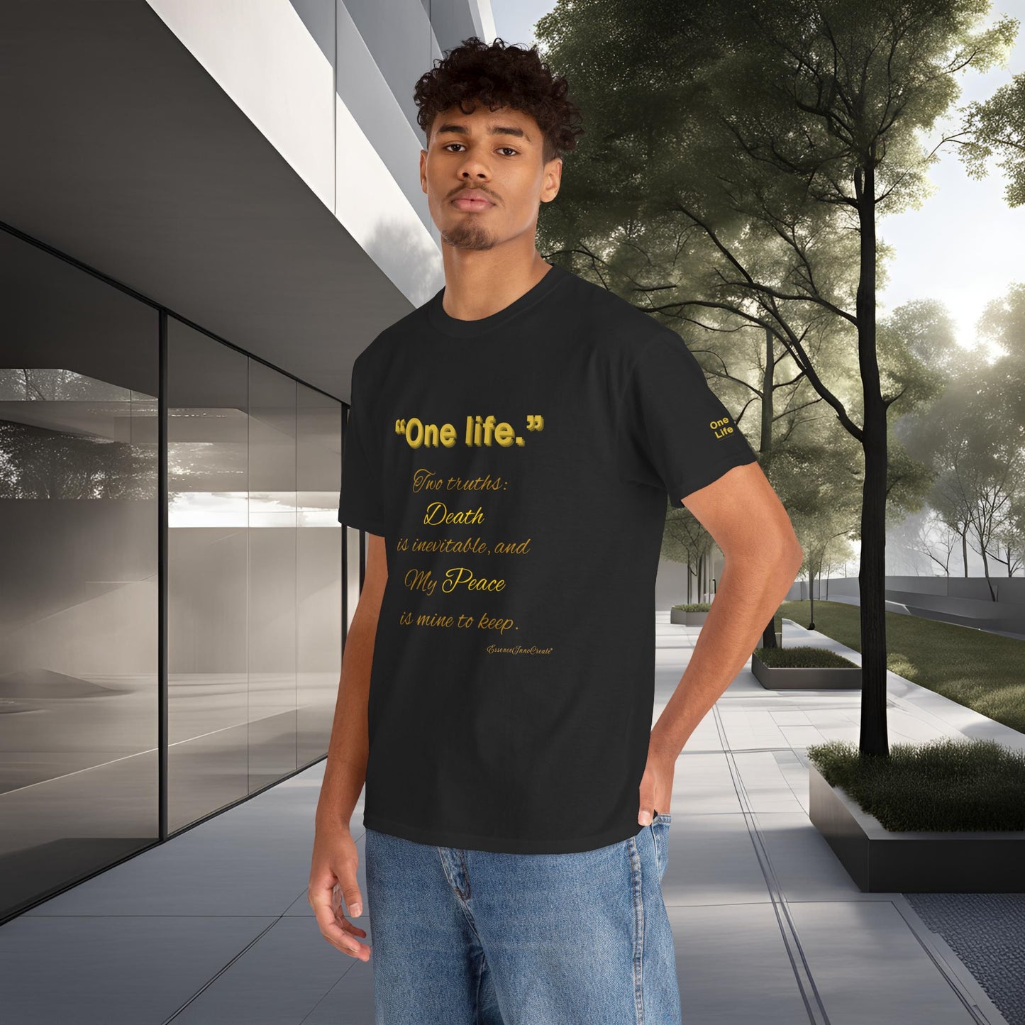Person wearing a black t-shirt with yellow One Life text in an outdoor setting