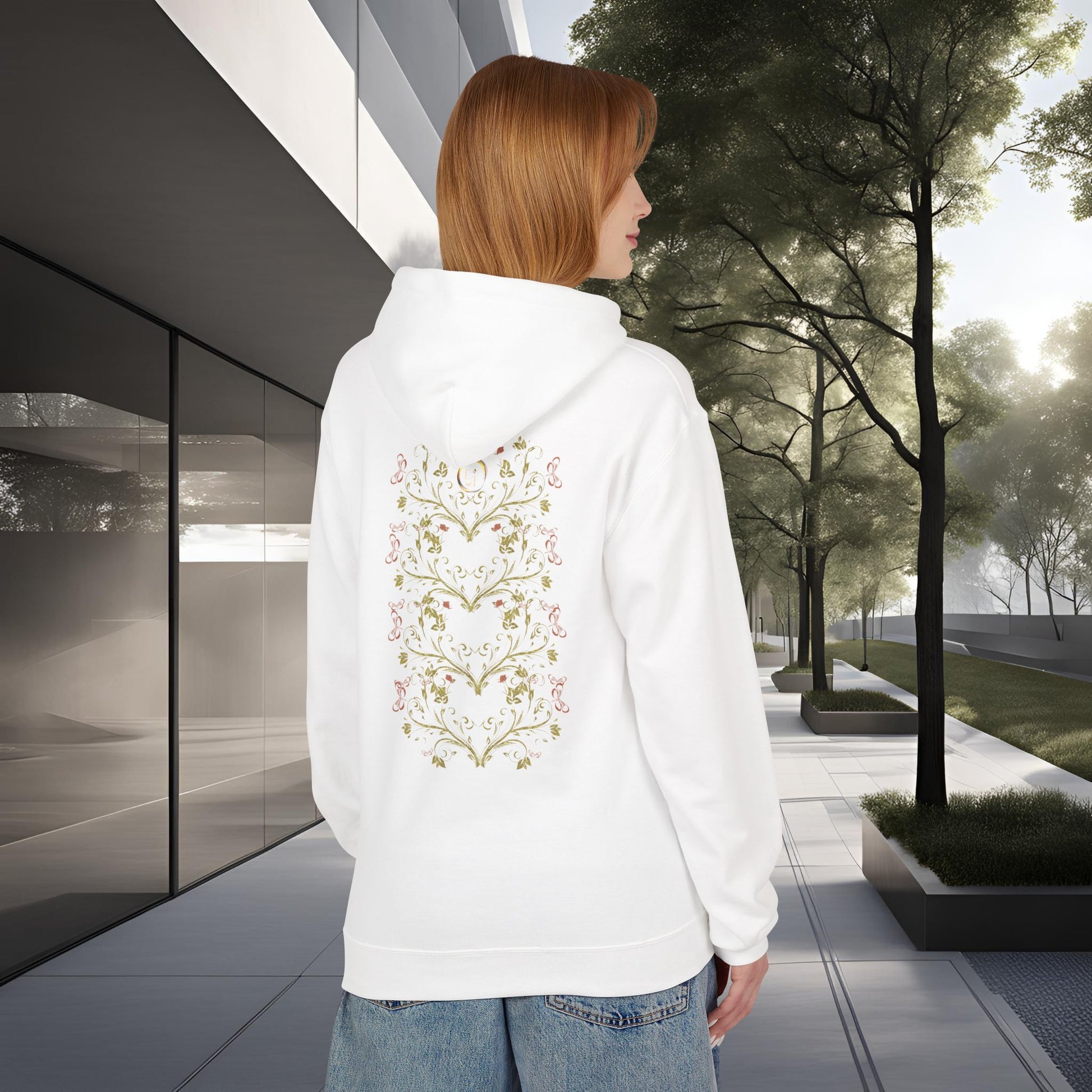 Person wearing a white hoodie with a floral Essence Innovation Bohemian Butterfly design on the back, standing in an urban setting.