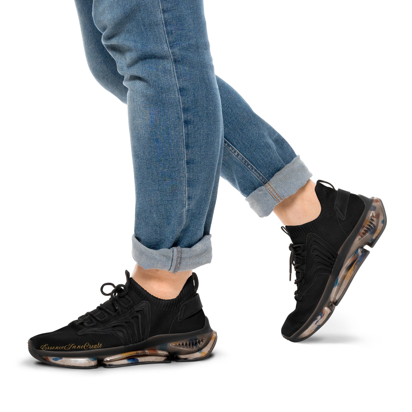 'EssenceInnoCreate' athletic shoes worn with blue jeans on a white background