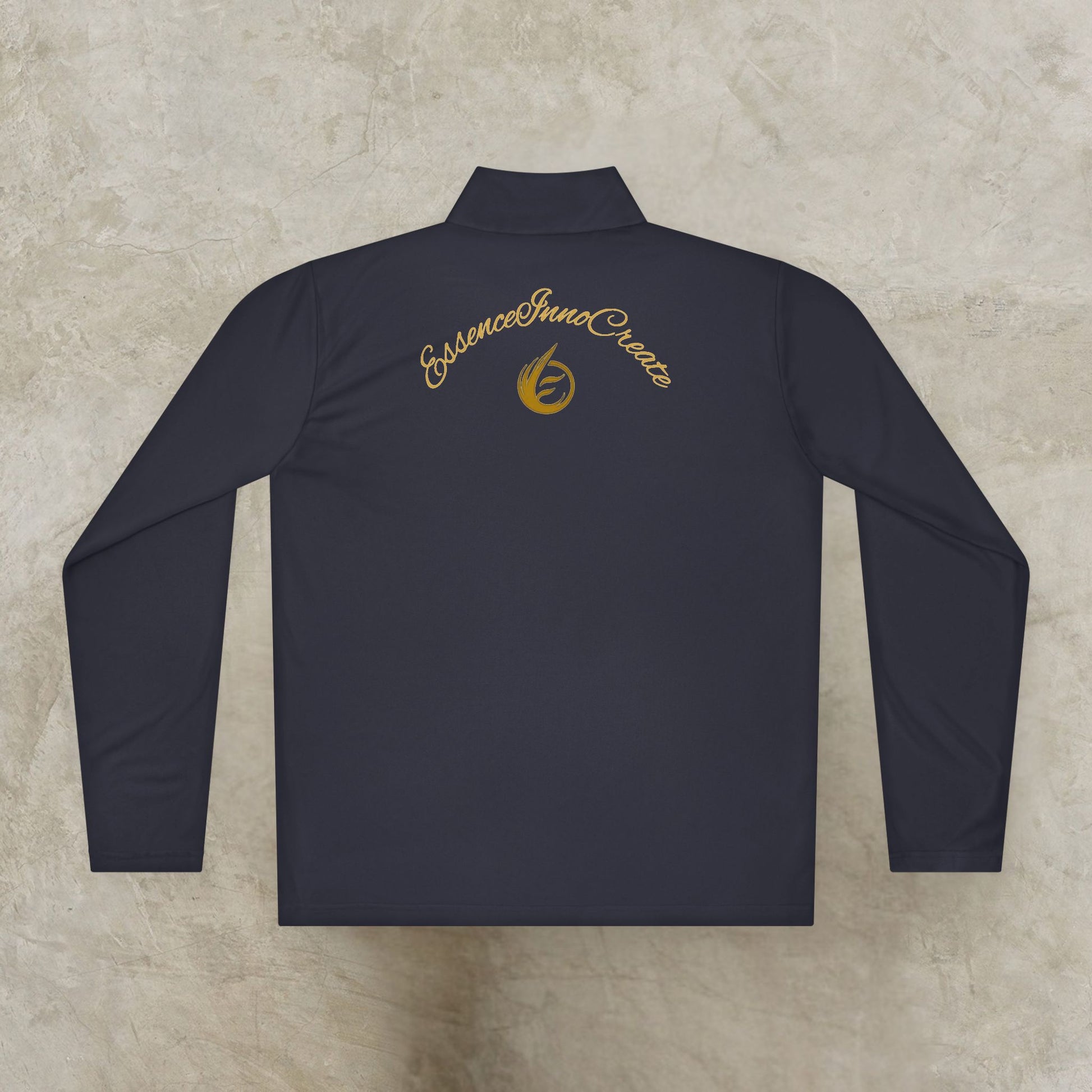 Black long-sleeve shirt with gold 'EssenceInnoCreate' logo on a textured beige background
