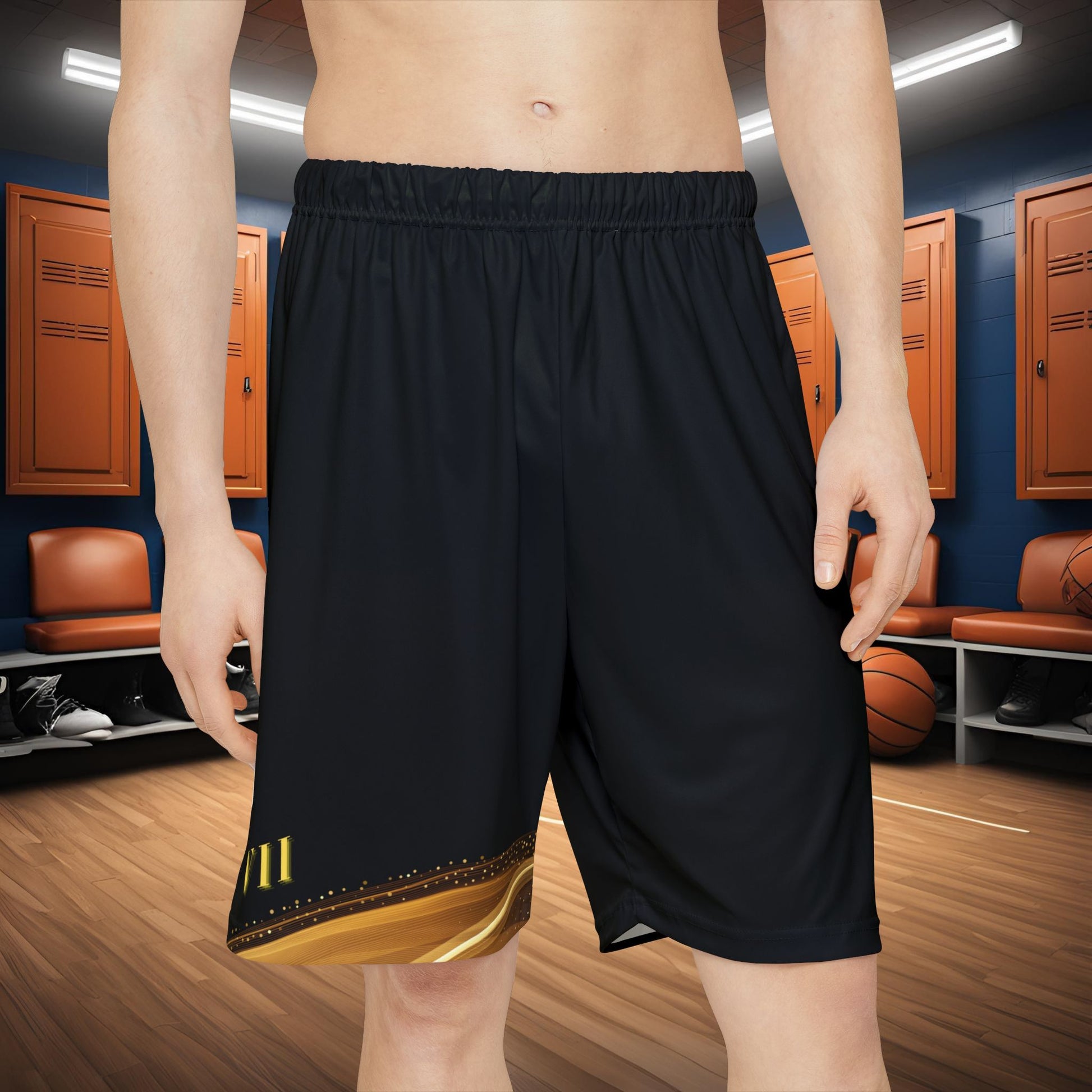 Person wearing black Essence Innovation shorts with a gold design in a basketball locker room.