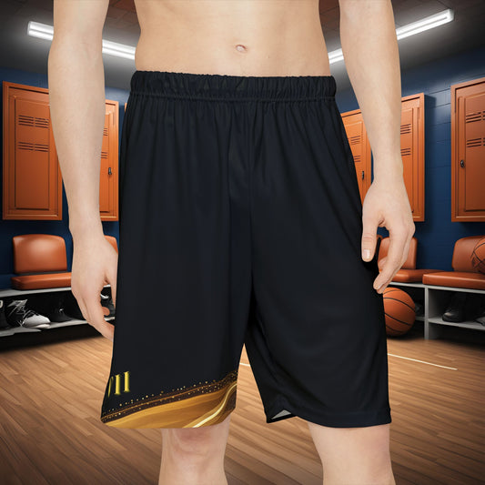 Person wearing black Essence Innovation shorts with a gold design in a basketball locker room.