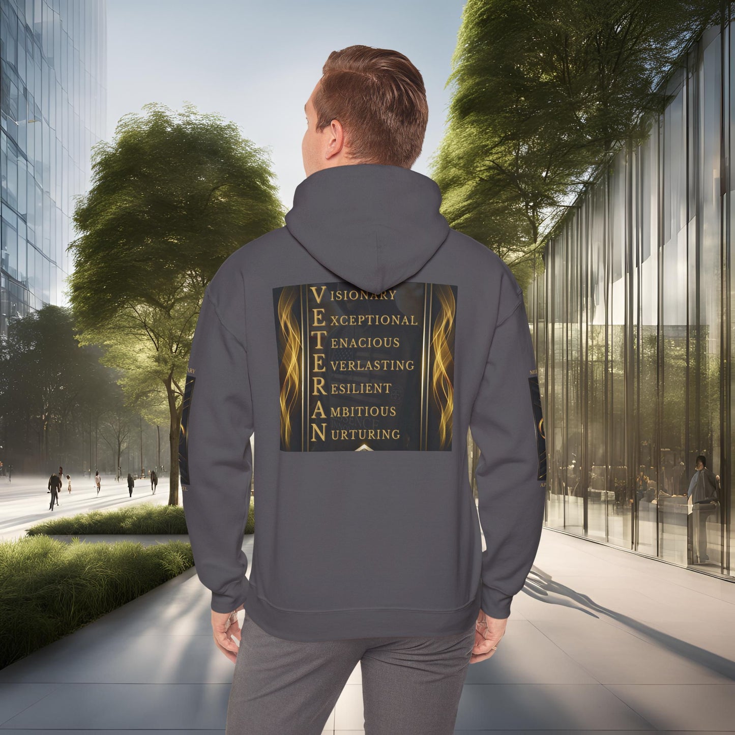 Person wearing a gray Essence Innovation hoodie with motivational text on the back, walking in an urban setting.