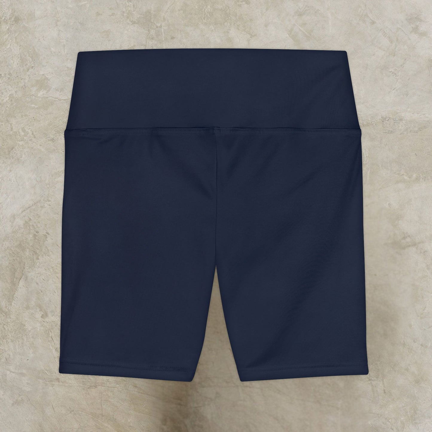 Navy blue shorts on a beige tiled floor